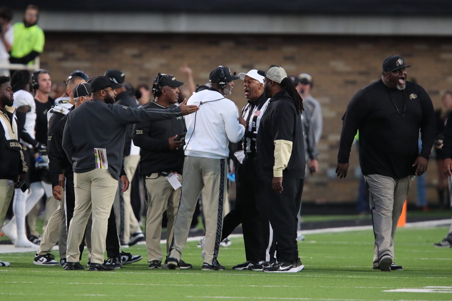 Colorado Buffalos head coach Deion Sanders discusses with Big 12 official Tutashina Salaam in the second half about items being thrown at the bench during the game against the Texas Tech Red Raiders at Jones AT&T Stadium and Cody Campbell Field.