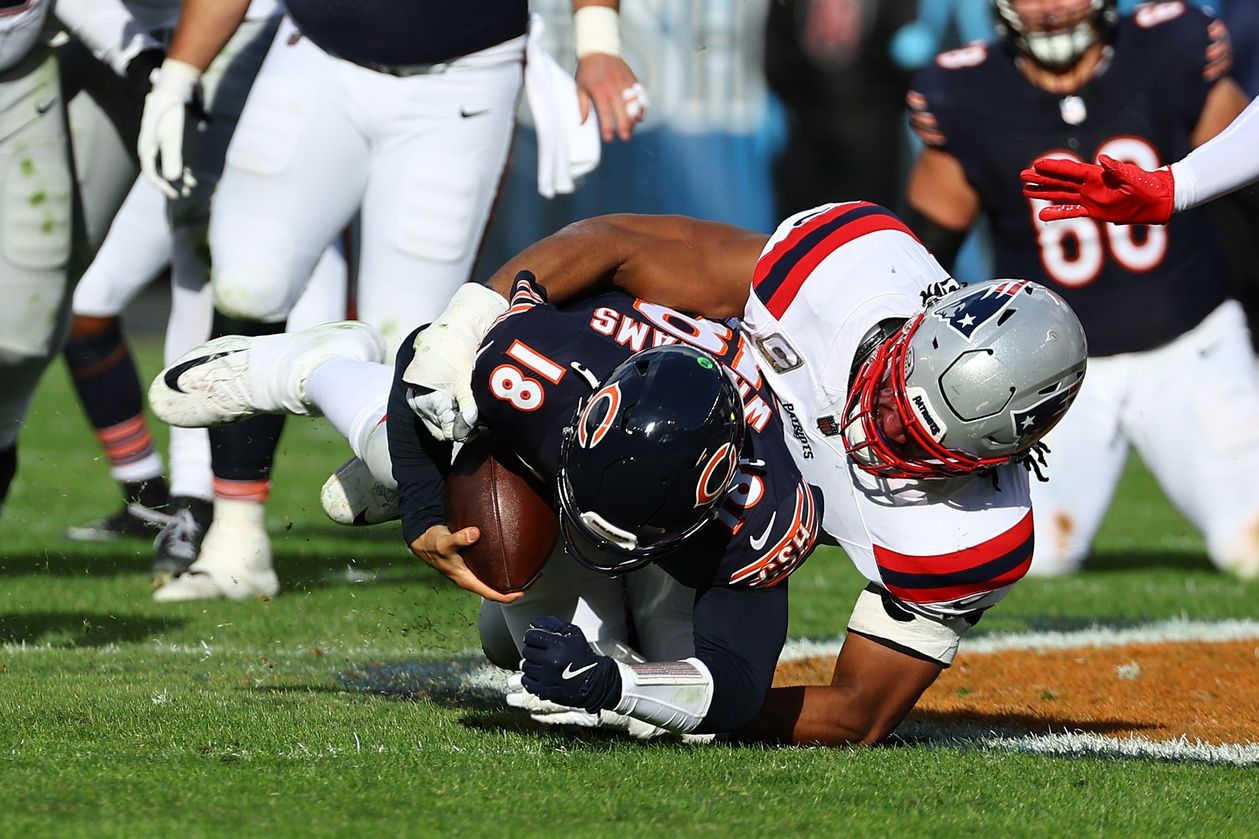 New England Patriots defensive end Deatrich Wise Jr. (91) sacks Chicago Bears quarterback Caleb Williams (18) during the second half at Soldier Field.