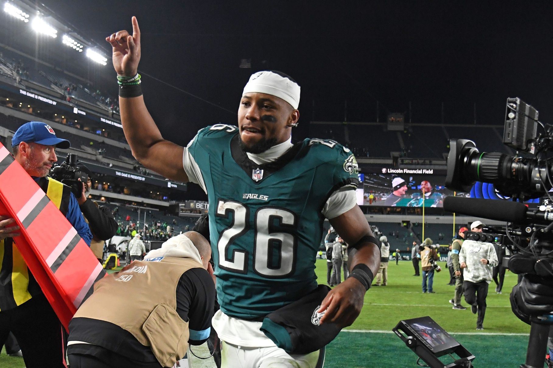 Philadelphia Eagles running back Saquon Barkley (26) runs off the field after win against the Washington Commanders at Lincoln Financial Field.