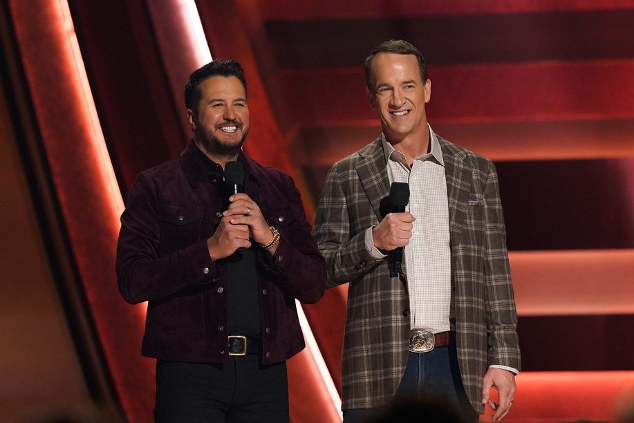 Luke Bryan and Peyton Manning speak onstage during the 58th Annual Country Music Association Awards in Nashville, Tenn., Wednesday, Nov. 20, 2024.