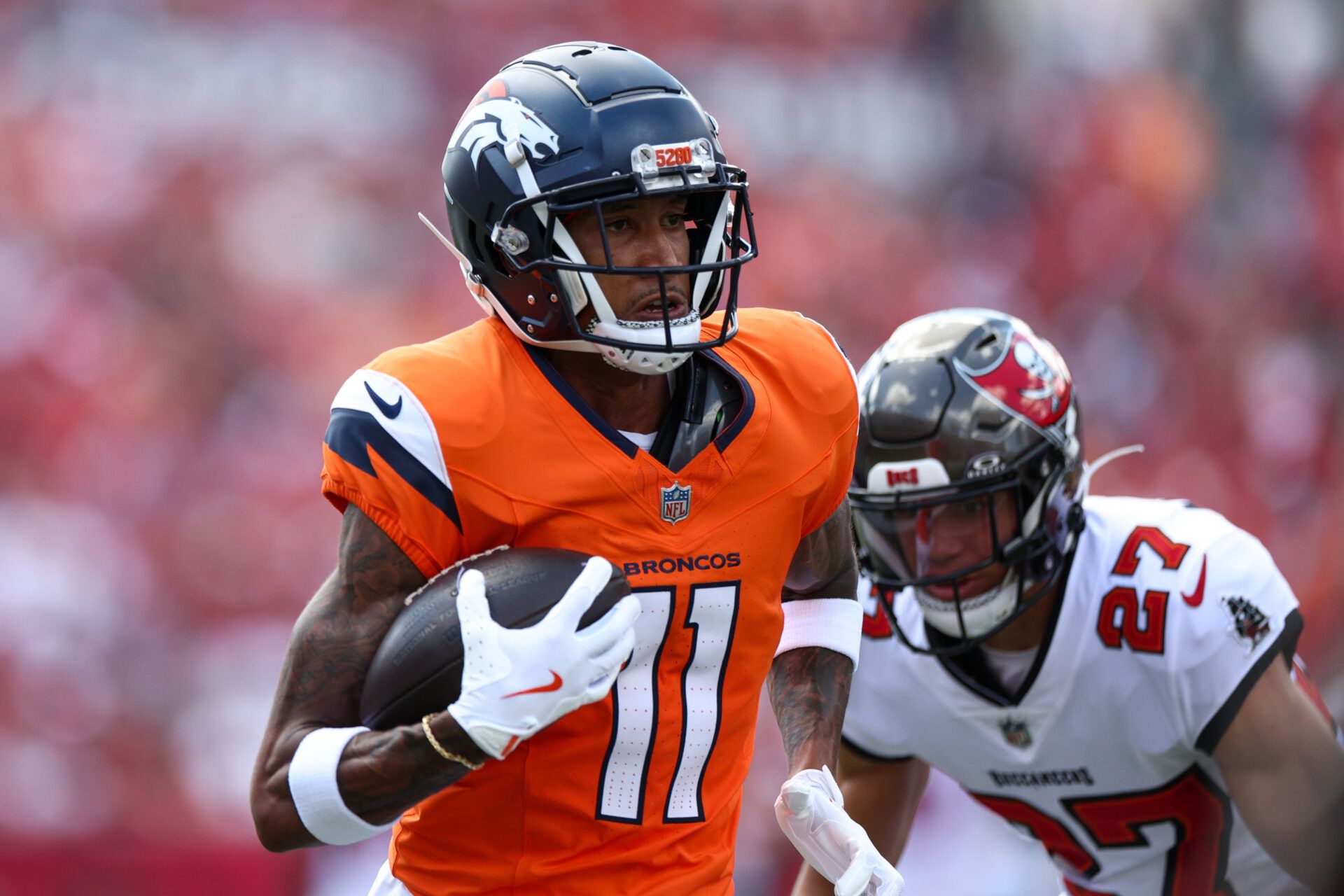 Sep 22, 2024; Tampa, Florida, USA; Denver Broncos wide receiver Josh Reynolds (11) makes a catch against the Tampa Bay Buccaneers in the first quarter at Raymond James Stadium. Mandatory Credit: Nathan Ray Seebeck-Imagn Images