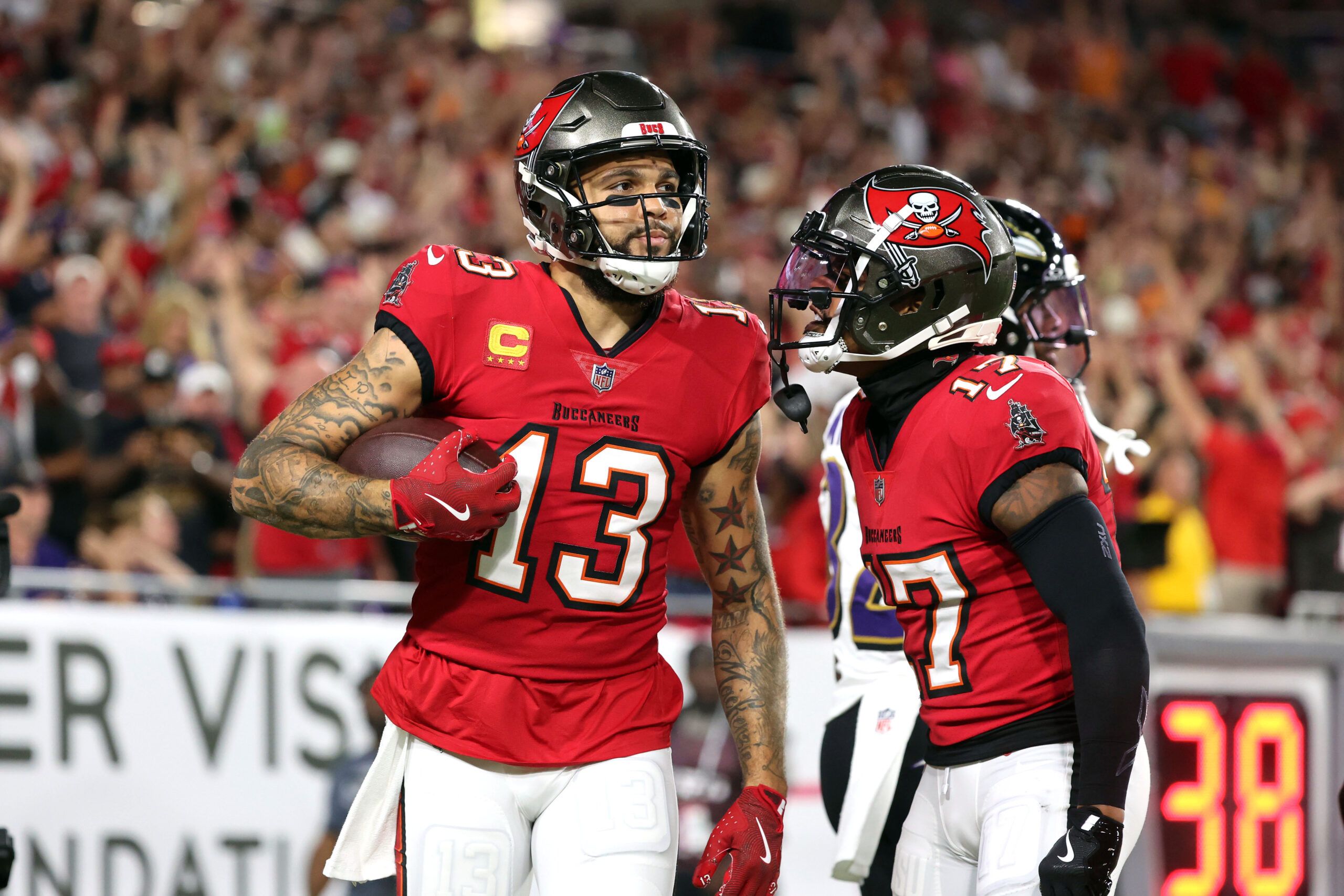 Oct 21, 2024; Tampa, Florida, USA; Tampa Bay Buccaneers wide receiver Mike Evans (13) catches the ball for a touchdown against the Baltimore Ravens during the first quarter at Raymond James Stadium. Mandatory Credit: Kim Klement Neitzel-Imagn Images