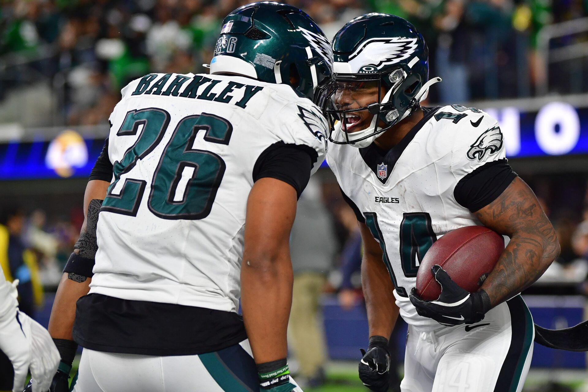 Nov 24, 2024; Inglewood, California, USA; Philadelphia Eagles running back Kenneth Gainwell (14) celebrates his touchdown scored against the Los Angeles Rams with running back Saquon Barkley (26) during the second half at SoFi Stadium. Mandatory Credit: Gary A. Vasquez-Imagn Images