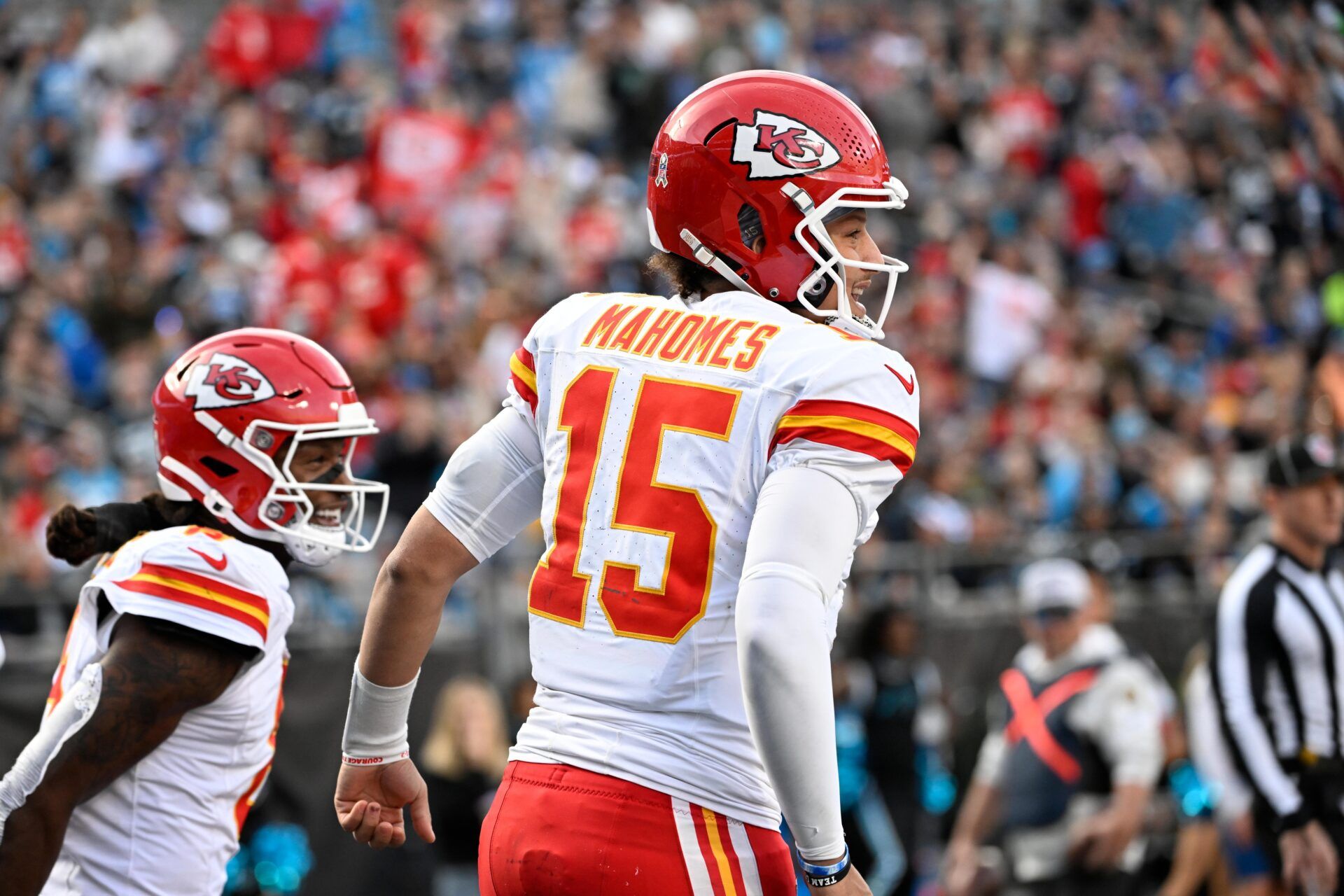 Kansas City Chiefs wide receiver DeAndre Hopkins (8) celebrates with quarterback Patrick Mahomes (15) after scoring a touchdown in the third quarter at Bank of America Stadium.