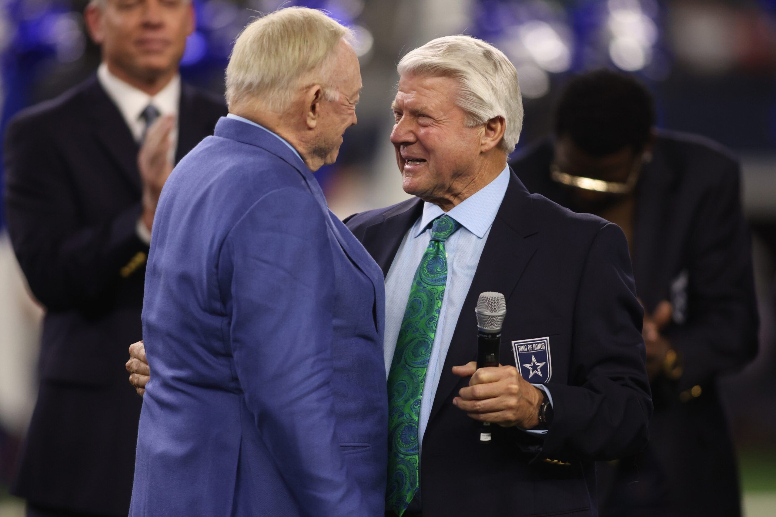 Dallas Cowboys owner Jerry Jones talks to former head coach Jimmy Johnson during the Ring of Honor ceremony during half of the game against the Detroit Lions at AT&T Stadium.