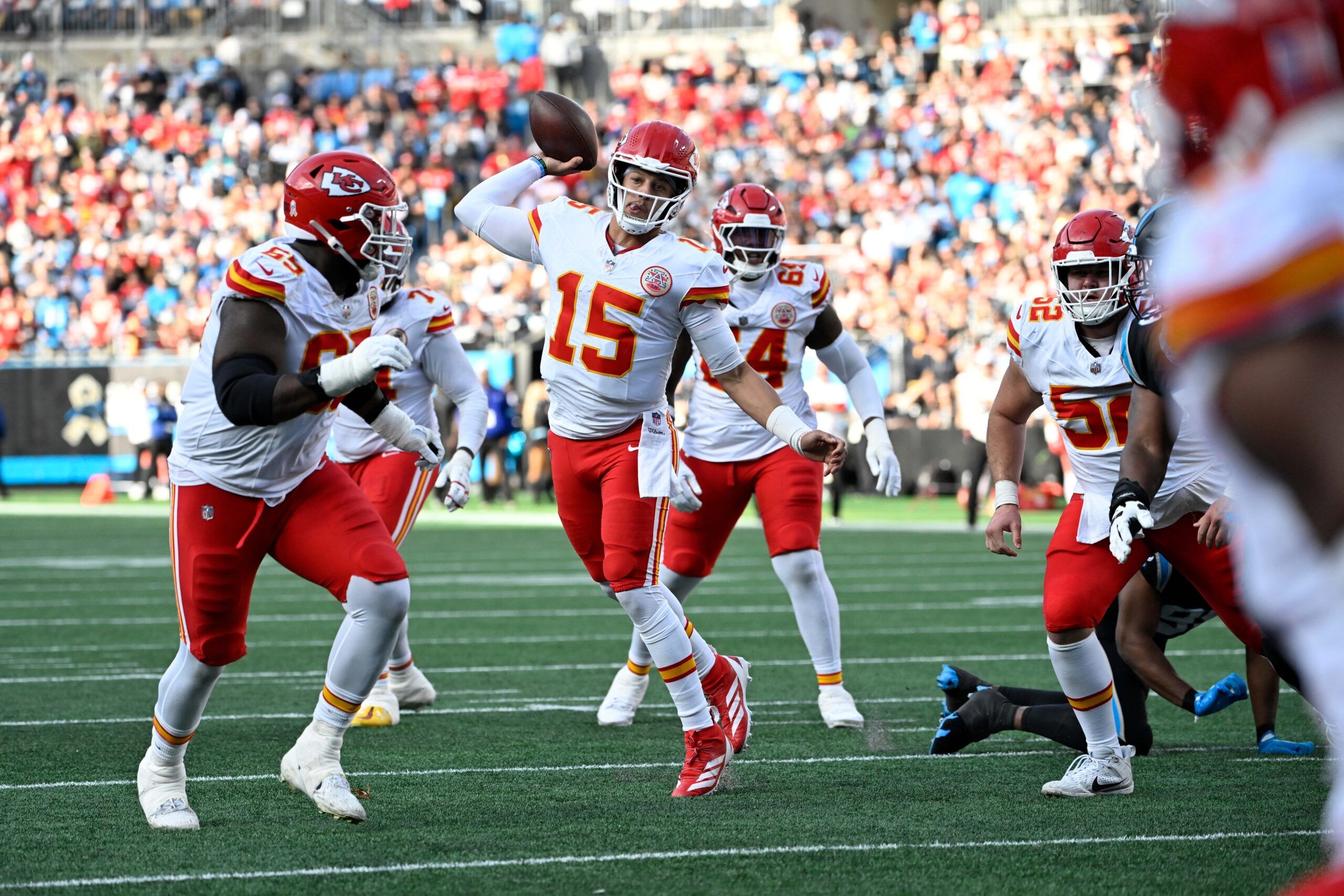 Kansas City Chiefs quarterback Patrick Mahomes (15) throws a touchdown pass in the third quarter at Bank of America Stadium.