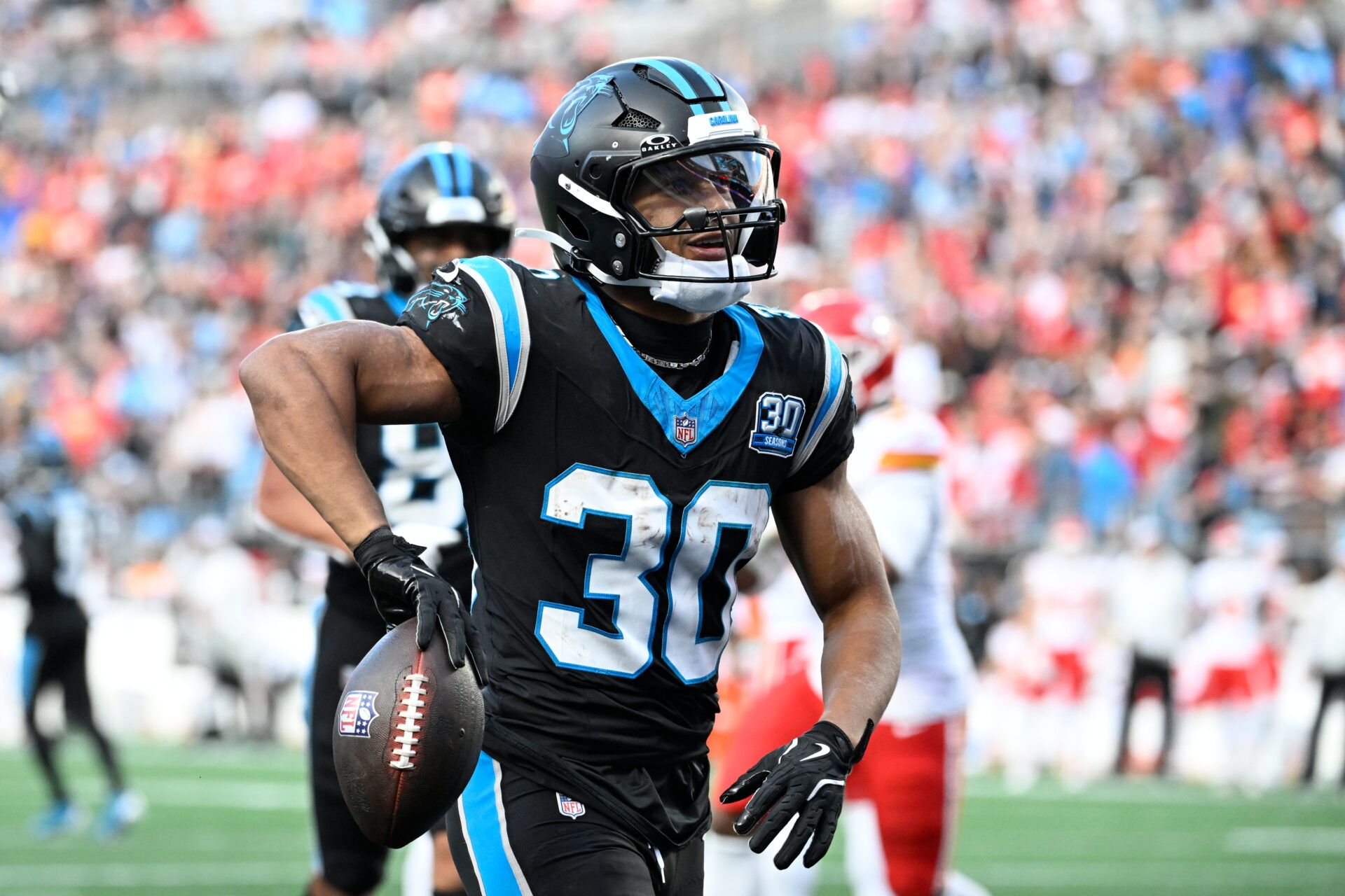 Nov 24, 2024; Charlotte, North Carolina, USA; Carolina Panthers running back Chuba Hubbard (30) with the ball after scoring a touchdown in the fourth quarter at Bank of America Stadium. Mandatory Credit: Bob Donnan-Imagn Images