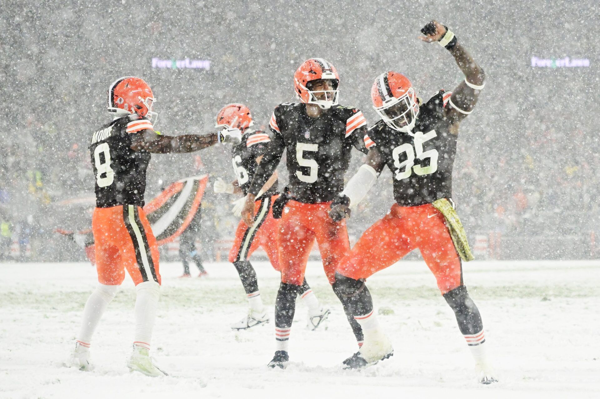 Cleveland Browns wide receiver Elijah Moore (8) and quarterback Jameis Winston (5) and tight end David Njoku (85) celebrate after Winston scored a touchdown during the second half against the Pittsburgh Steelers at Huntington Bank Field.