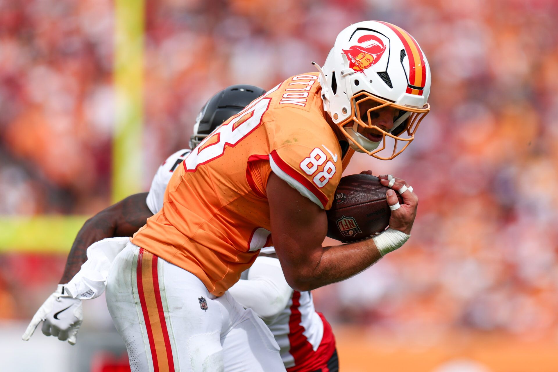 Oct 27, 2024; Tampa, Florida, USA; Tampa Bay Buccaneers tight end Cade Otton (88) runs with the ball against the Atlanta Falcons in the second quarter at Raymond James Stadium. Mandatory Credit: Nathan Ray Seebeck-Imagn Images