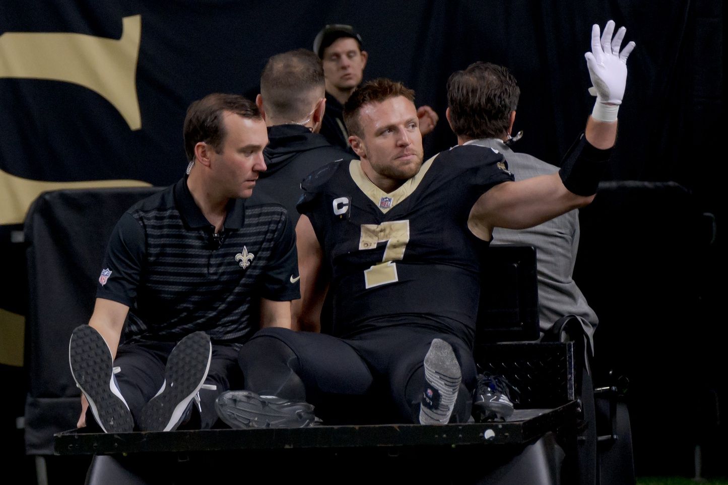 New Orleans Saints tight end Taysom Hill (7) leaves the field after an injury against the Los Angeles Rams during the second half at Caesars Superdome.