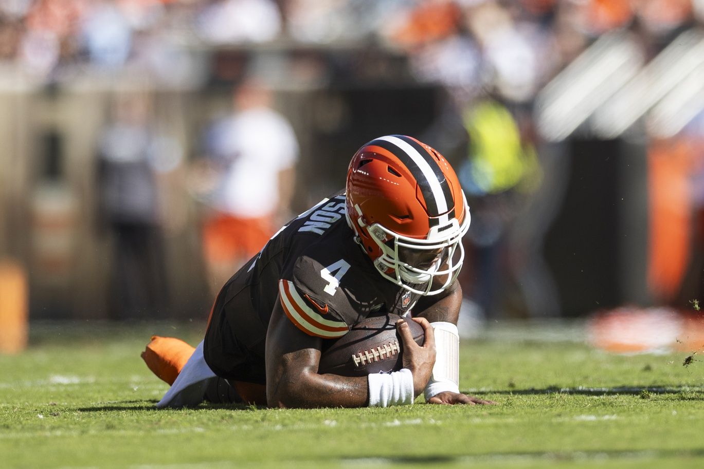 Cleveland Browns quarterback Deshaun Watson (4) falls to the ground with a torn Achilles during the second quarter against the Cincinnati Bengals at Huntington Bank Field.