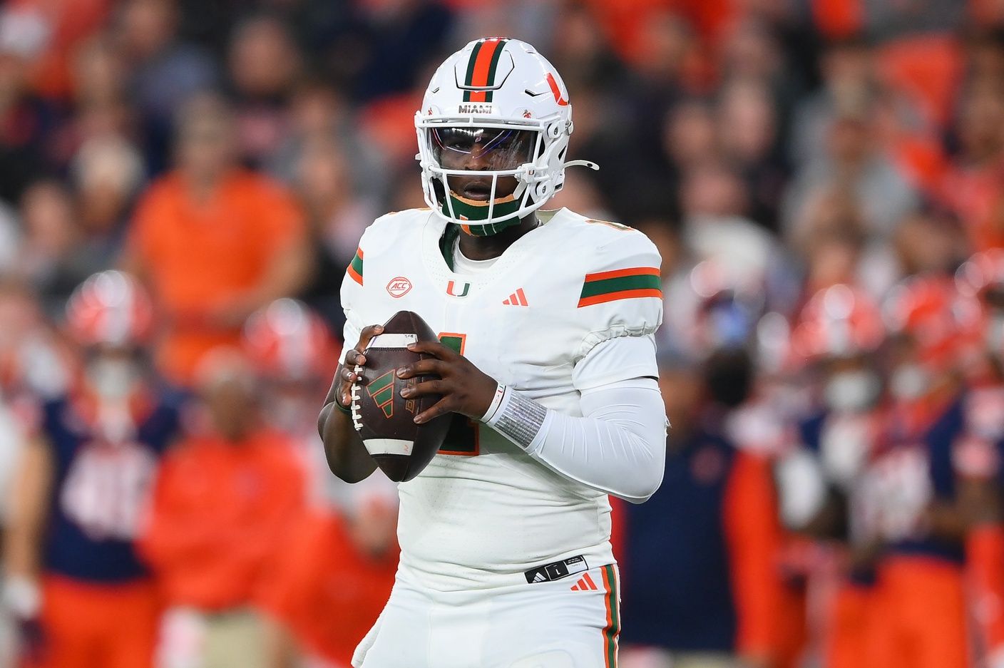 Miami Hurricanes quarterback Cam Ward (1) drops back to pass against the Syracuse Orange during the first half at the JMA Wireless Dome.