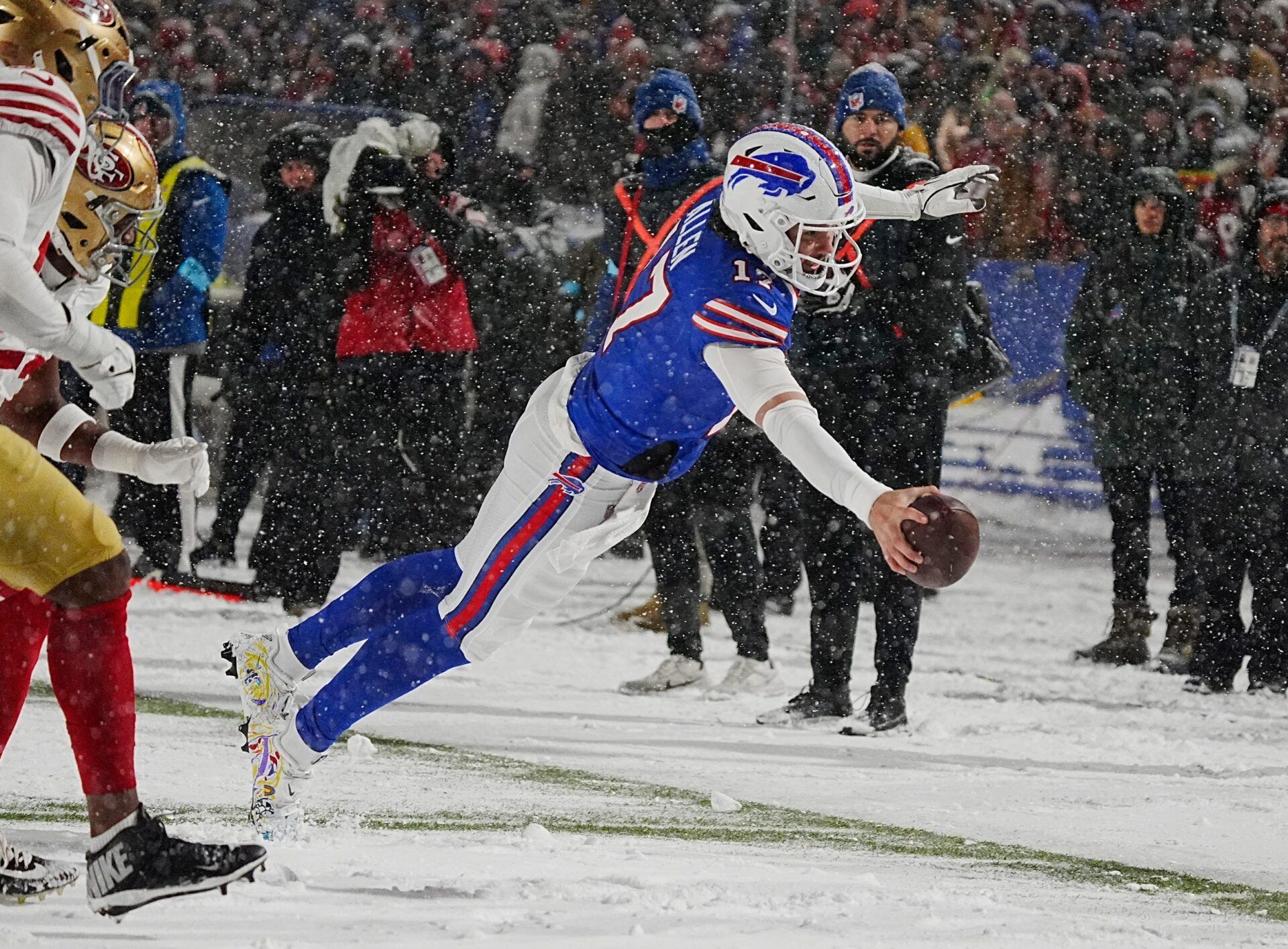 Josh Allen’s viral snow day touchdown and historic performance helped the Bills dominate the 49ers, clinching the AFC East with a 35-10 win.