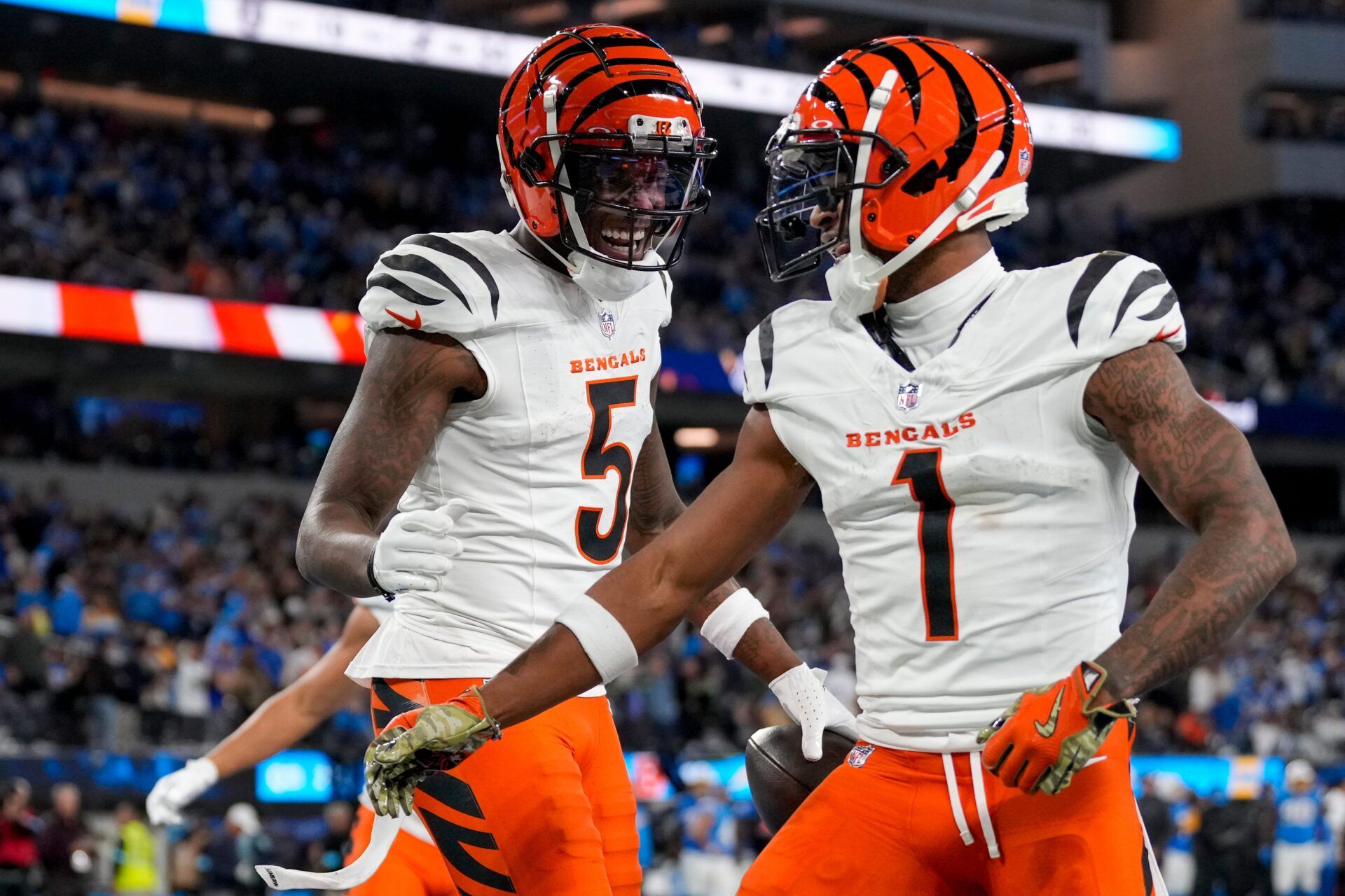 Cincinnati Bengals wide receiver Tee Higgins (5) and Cincinnati Bengals wide receiver Ja'Marr Chase (1) celebrate a Higgins touchdown in the third quarter of the NFL Week 11 game between the Los Angeles Chargers and the Cincinnati Bengals at SoFi Stadium in Inglewood, Calif., on Sunday, Nov. 17, 2024. The Chargers won 34-27.