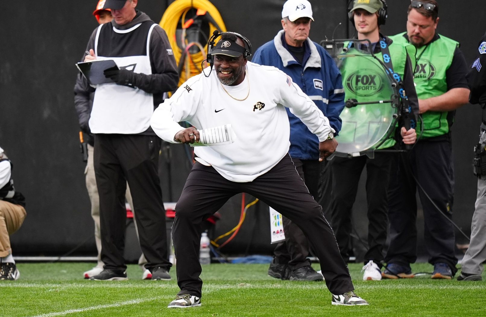 Colorado Buffaloes senior quality control analyst Warren Sapp reacts to a play in the second half against the Utah Utes at Folsom Field.