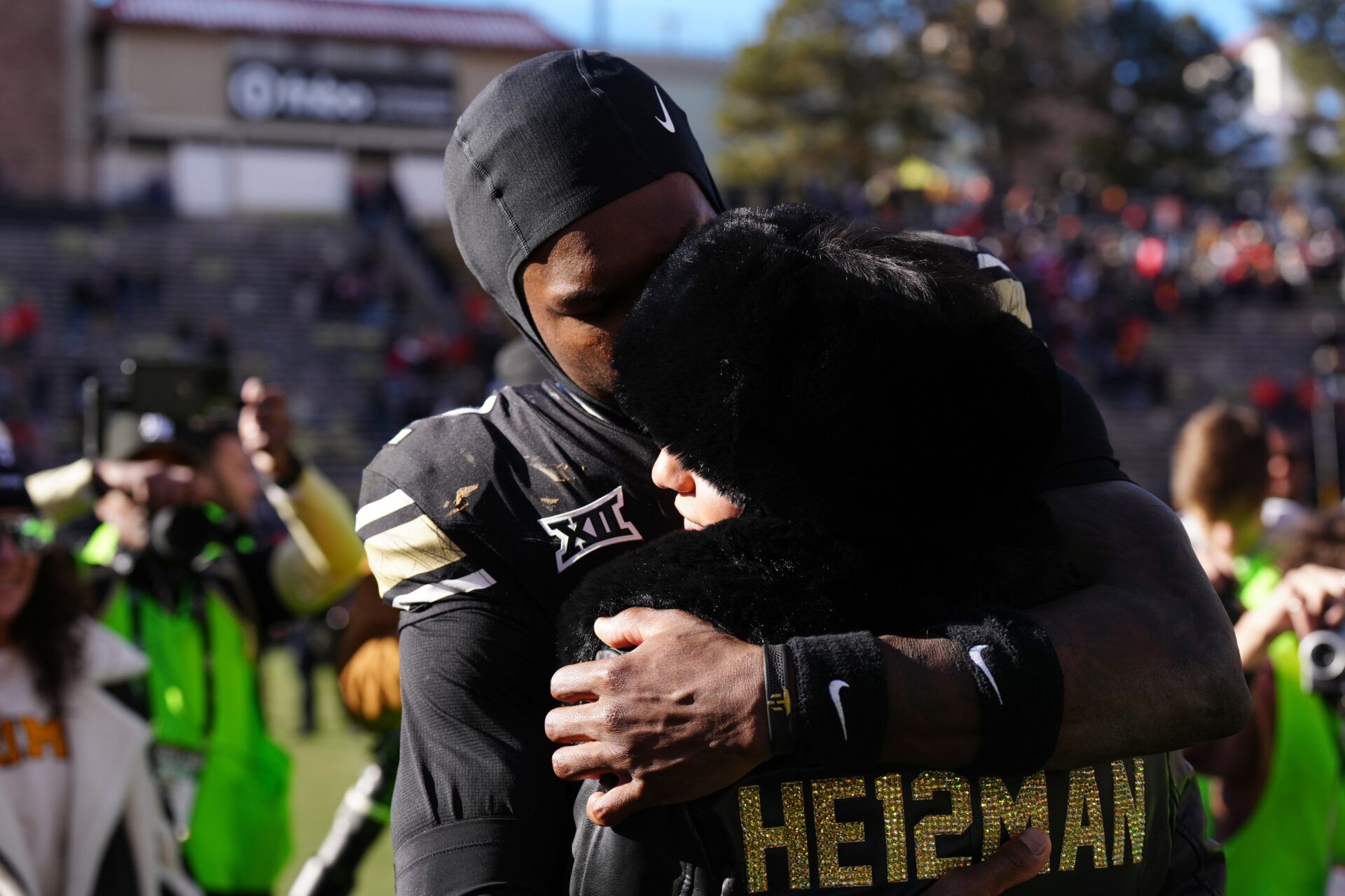 Colorado Buffaloes wide receiver Travis Hunter (12) hugs his girl friend following the win against the Oklahoma State Cowboys at Folsom Field.