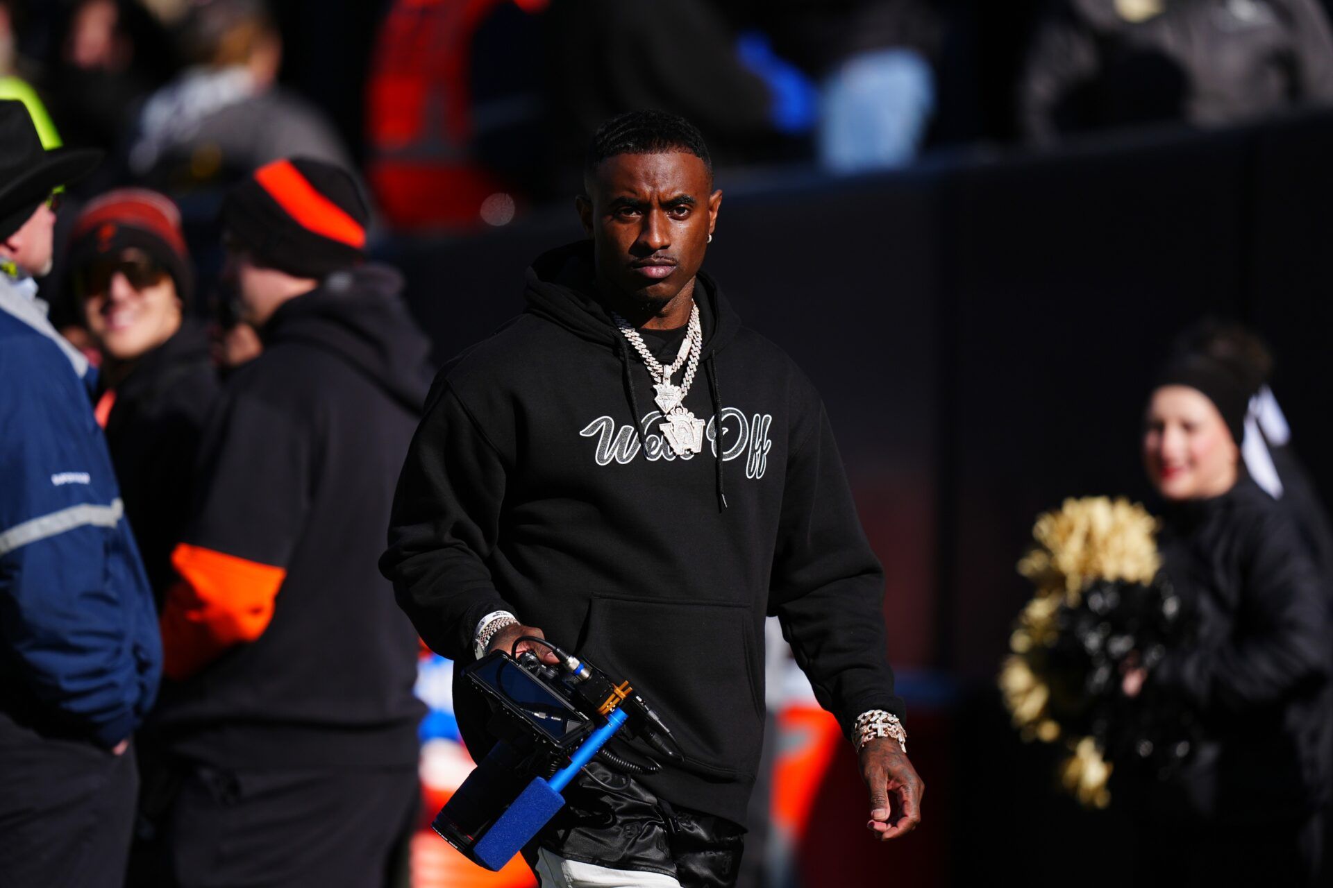 Colorado Buffaloes social media producer Deion Sanders Jr. walks the sidelines in the second quarter against the Oklahoma State Cowboys at Folsom Field.