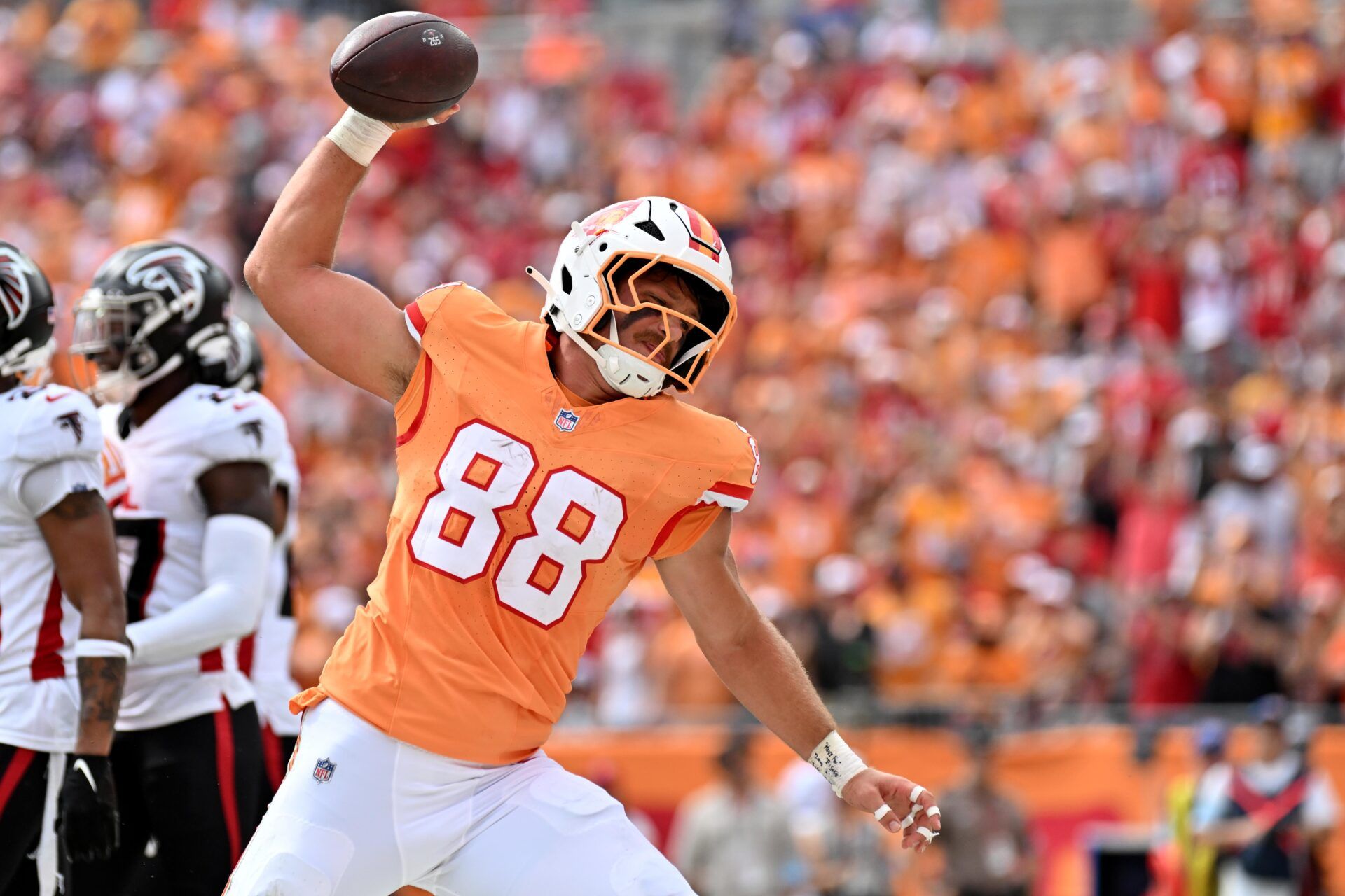 Oct 27, 2024; Tampa, Florida, USA; Tampa Bay Buccaneers tight end Cade Otton (88) spikes the ball after scoring a touchdown in the first half against the Atlanta Falcons at Raymond James Stadium. Mandatory Credit: Jonathan Dyer-Imagn Images