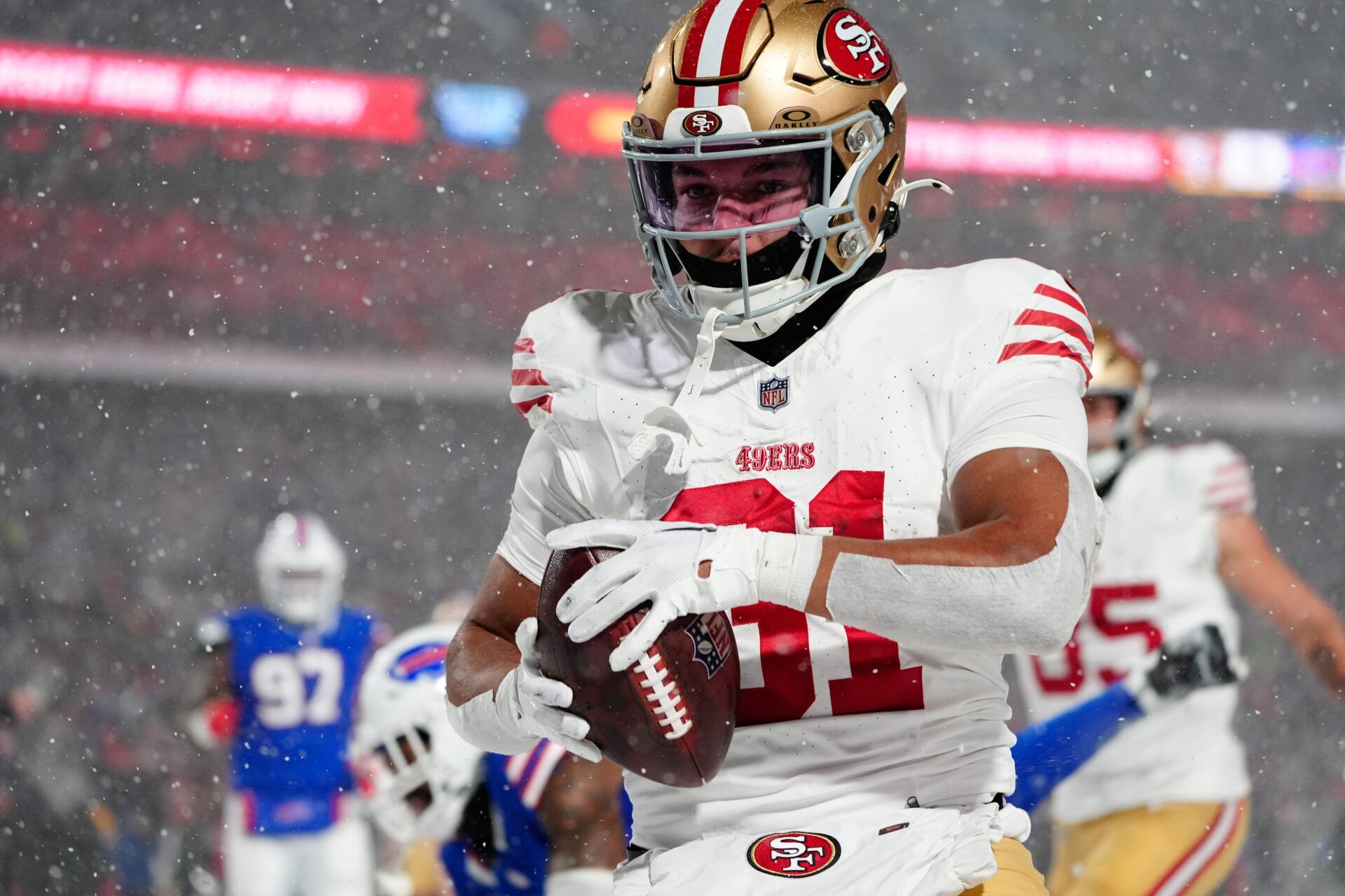 Dec 1, 2024; Orchard Park, New York, USA; San Francisco 49ers running back Isaac Guerendo (31) scores a touchdown against the Buffalo Bills during the second half at Highmark Stadium. Mandatory Credit: Gregory Fisher-Imagn Images