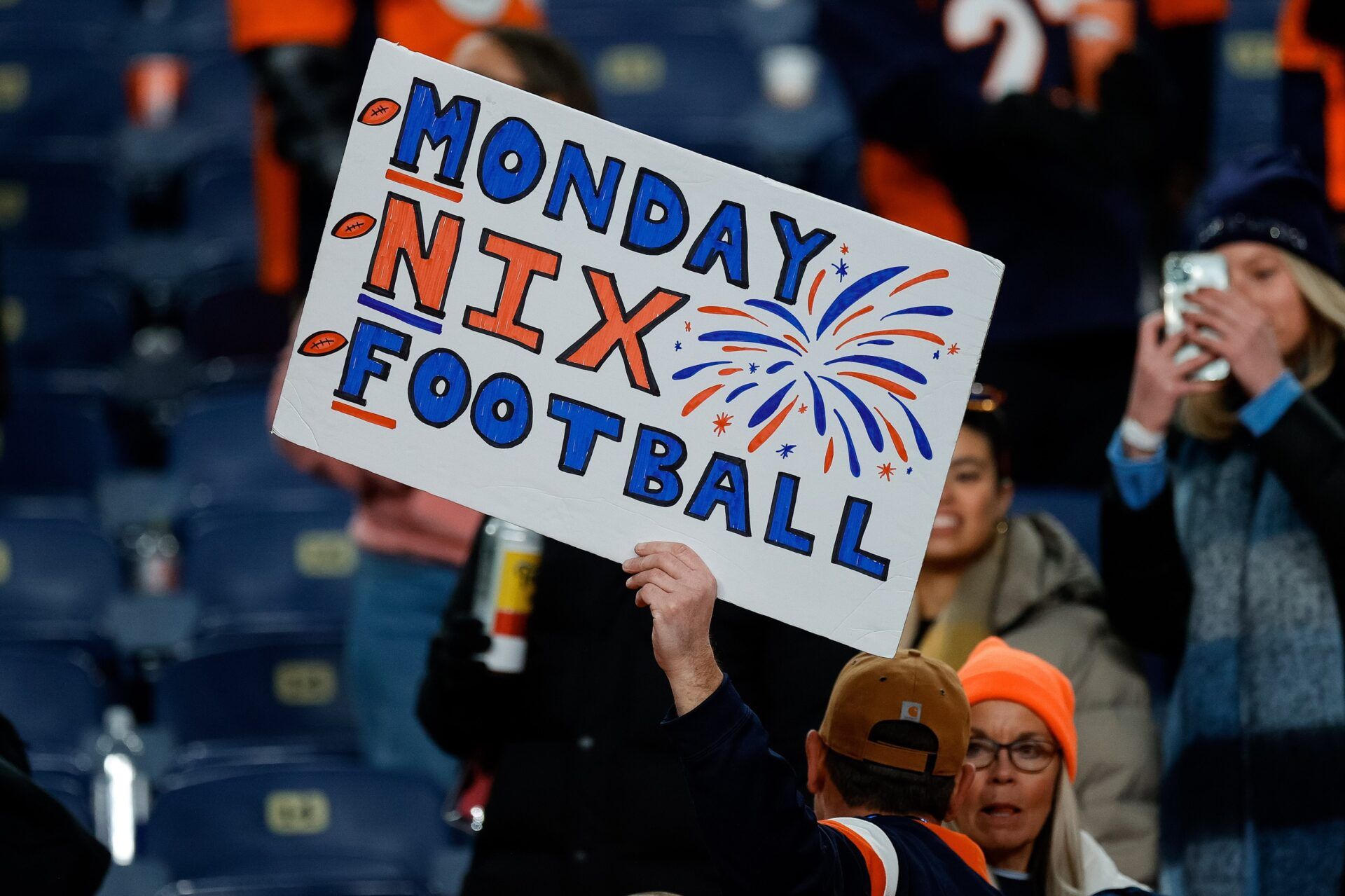 Dec 2, 2024; Denver, Colorado, USA; A fan holds up a sign for Denver Broncos quarterback Bo Nix (not pictured) after the game against the Cleveland Browns at Empower Field at Mile High. Mandatory Credit: Isaiah J. Downing-Imagn Images