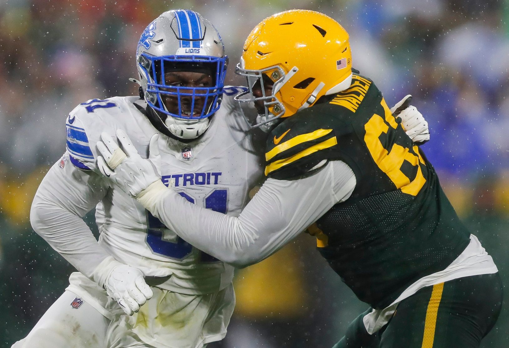 Detroit Lions defensive end Levi Onwuzurike (91) rushes the quarterback as Green Bay Packers offensive tackle Rasheed Walker (63) blocks on Sunday, November 3, 2024, at Lambeau Field in Green Bay, Wis. The Lions won the game, 24-14.