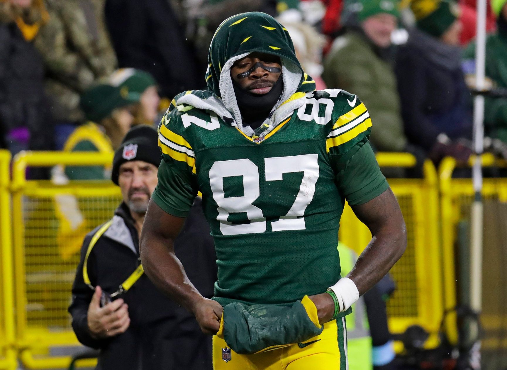 Green Bay Packers wide receiver Romeo Doubs (87) leaves the field after getting injured on a pass interference play commited by San Francisco 49ers cornerback Renardo Green (0) in the third quarter during their football game Sunday, November 24, 2024, at Lambeau Field in Green Bay, Wisconsin.