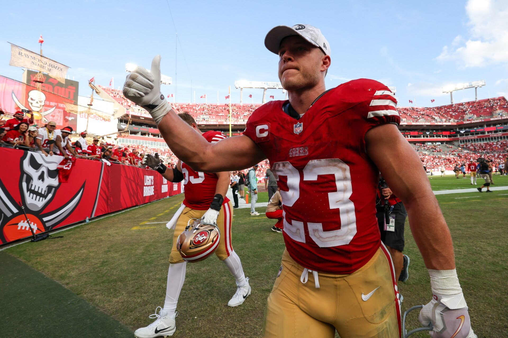 San Francisco 49ers running back Christian McCaffrey (23) celebrates after beating the Tampa Bay Buccaneers at Raymond James Stadium.