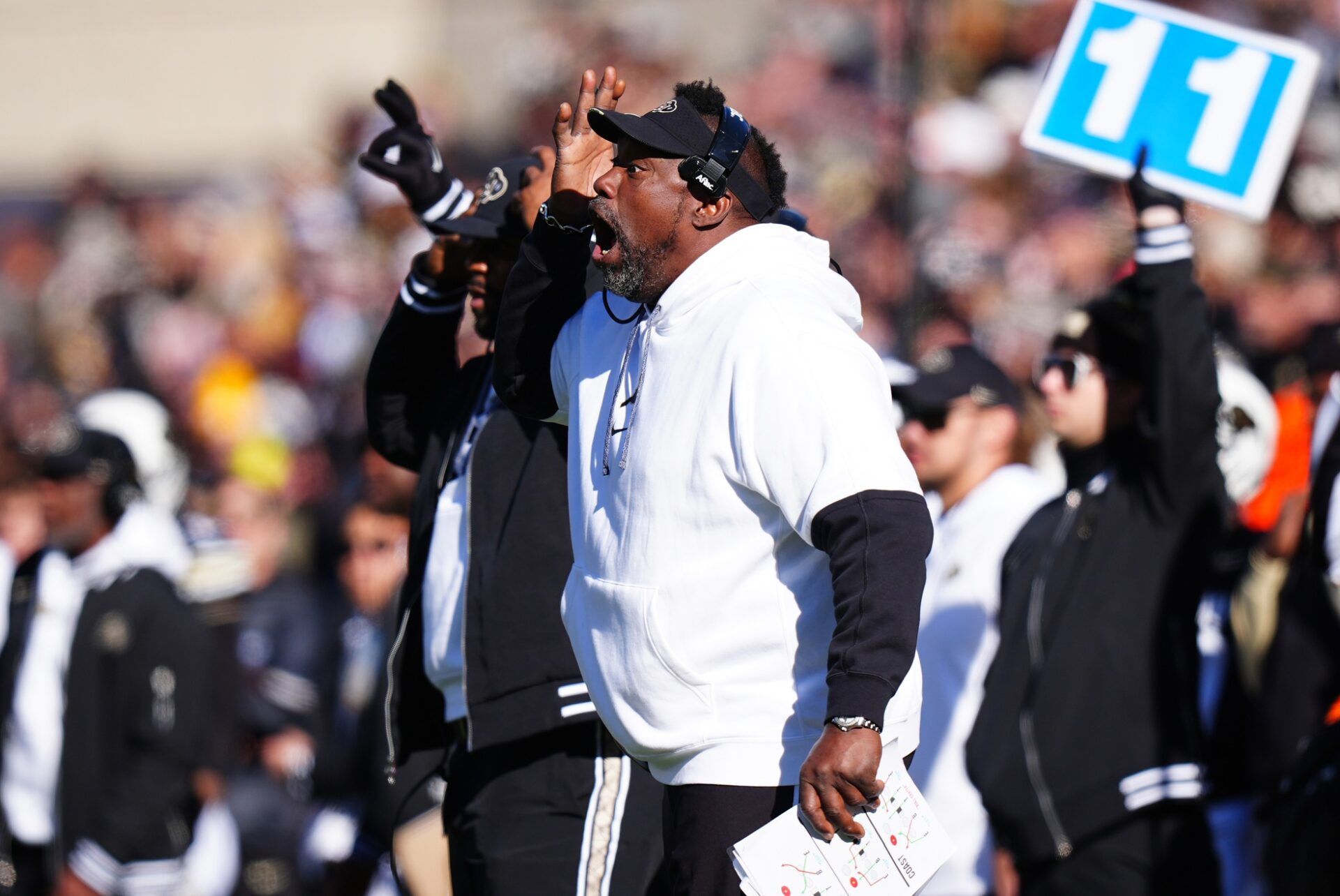 Colorado Buffaloes assistant coach Warren Sapp calls out in the second quarter at Folsom Field.