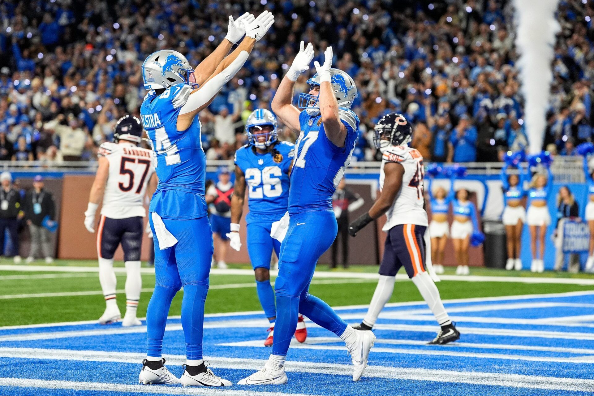 Detroit Lions tight end Sam LaPorta (87) celebrates a touchdown against Chicago Bears with tight end Shane Zylstra (84) during the second half at Ford Field in Detroit on Thursday, Nov. 28, 2024.