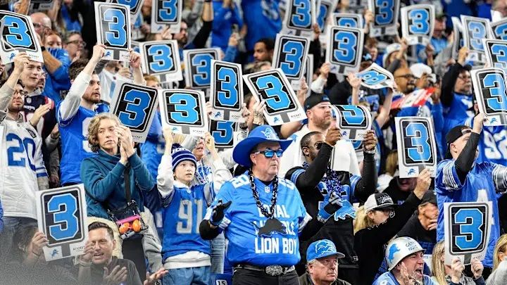 Detroit Lions fans at Ford Field hold up 