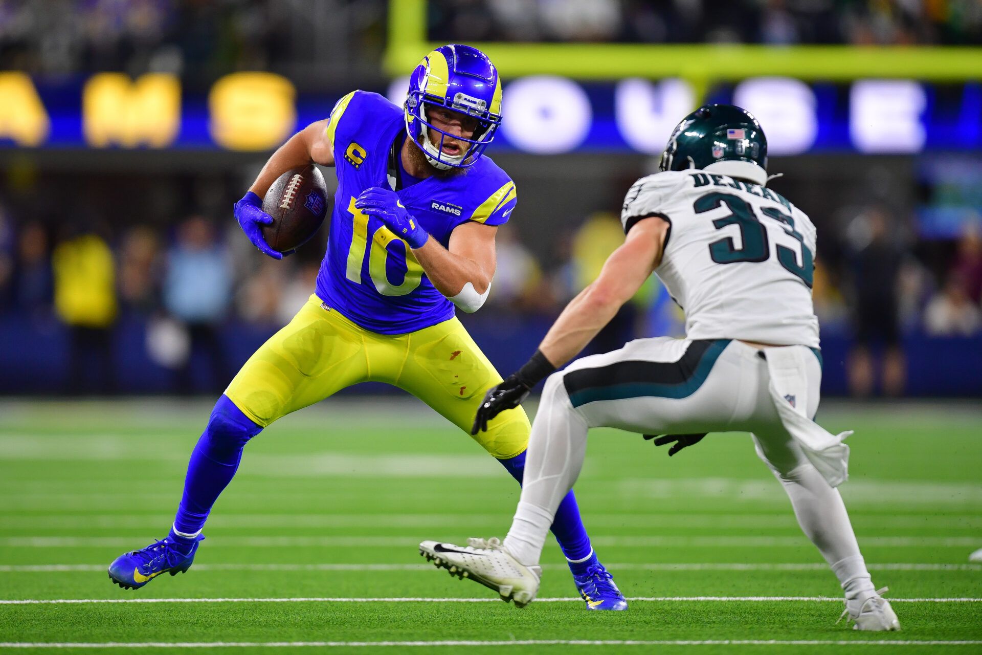 Nov 24, 2024; Inglewood, California, USA; Los Angeles Rams wide receiver Cooper Kupp (10) runs the ball against Philadelphia Eagles cornerback Cooper DeJean (33) during the second half at SoFi Stadium. Mandatory Credit: Gary A. Vasquez-Imagn Images