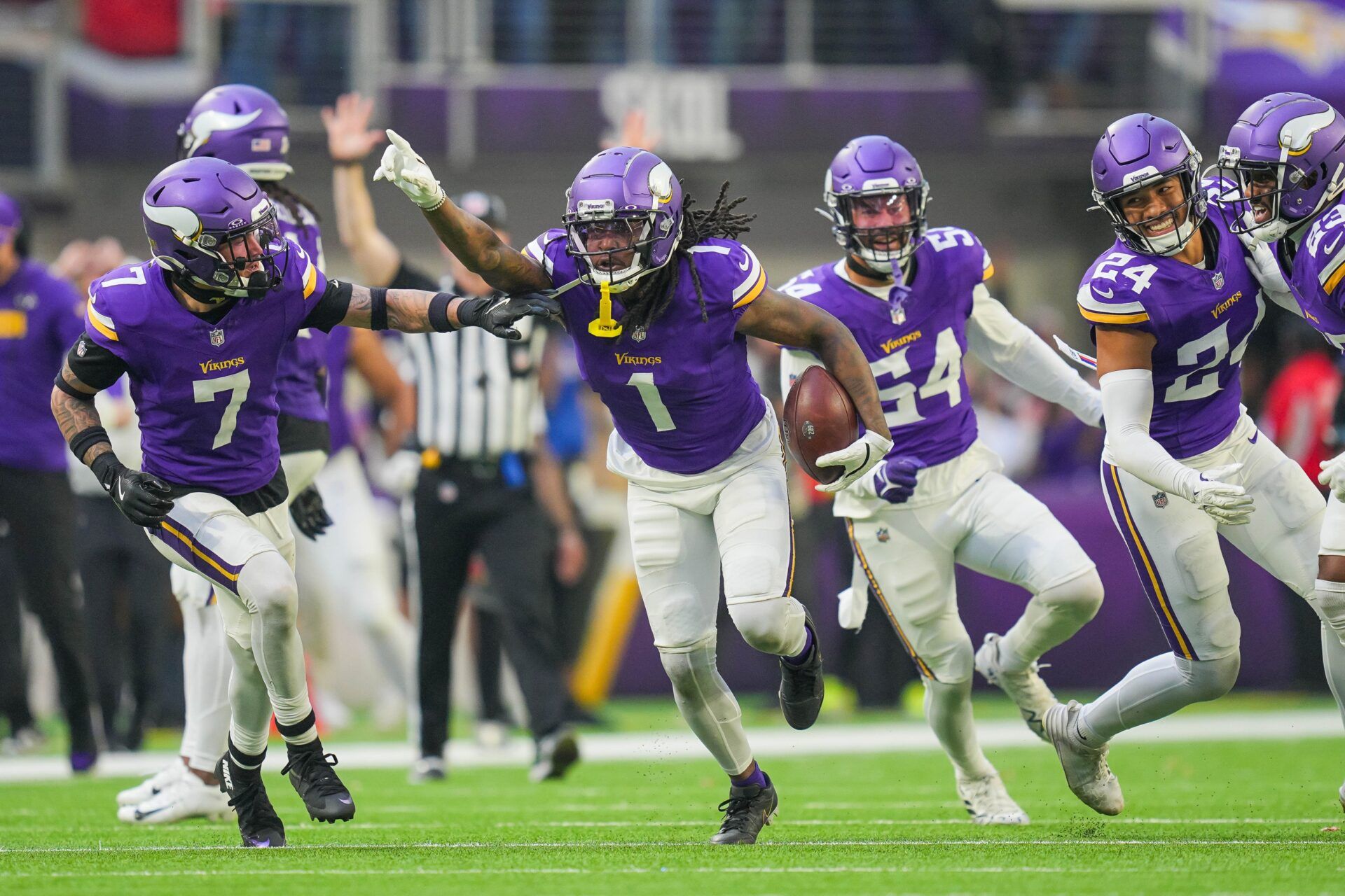 Minnesota Vikings cornerback Shaquill Griffin (1) celebrates his interception against the Arizona Cardinals in the fourth quarter at U.S. Bank Stadium.