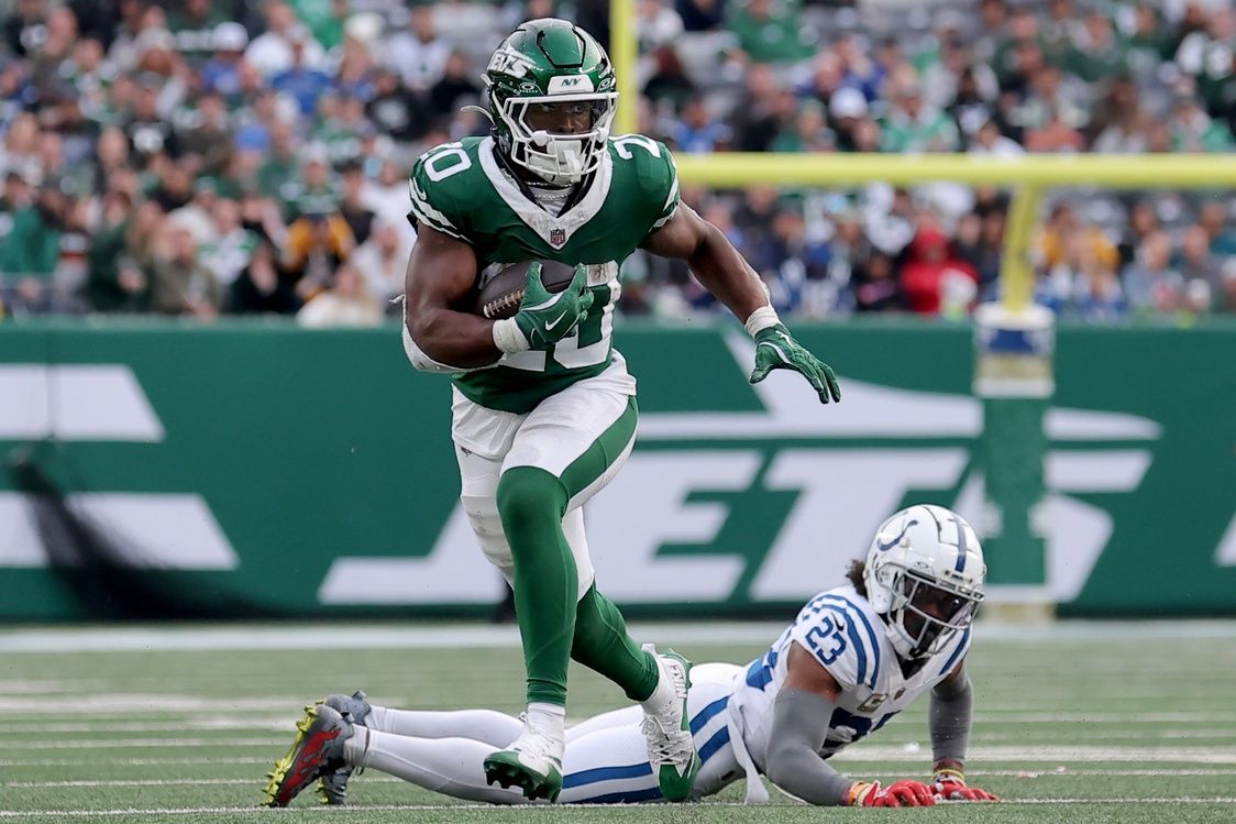 New York Jets running back Breece Hall (20) runs with the ball against Indianapolis Colts cornerback Kenny Moore II (23) during the fourth quarter at MetLife Stadium.