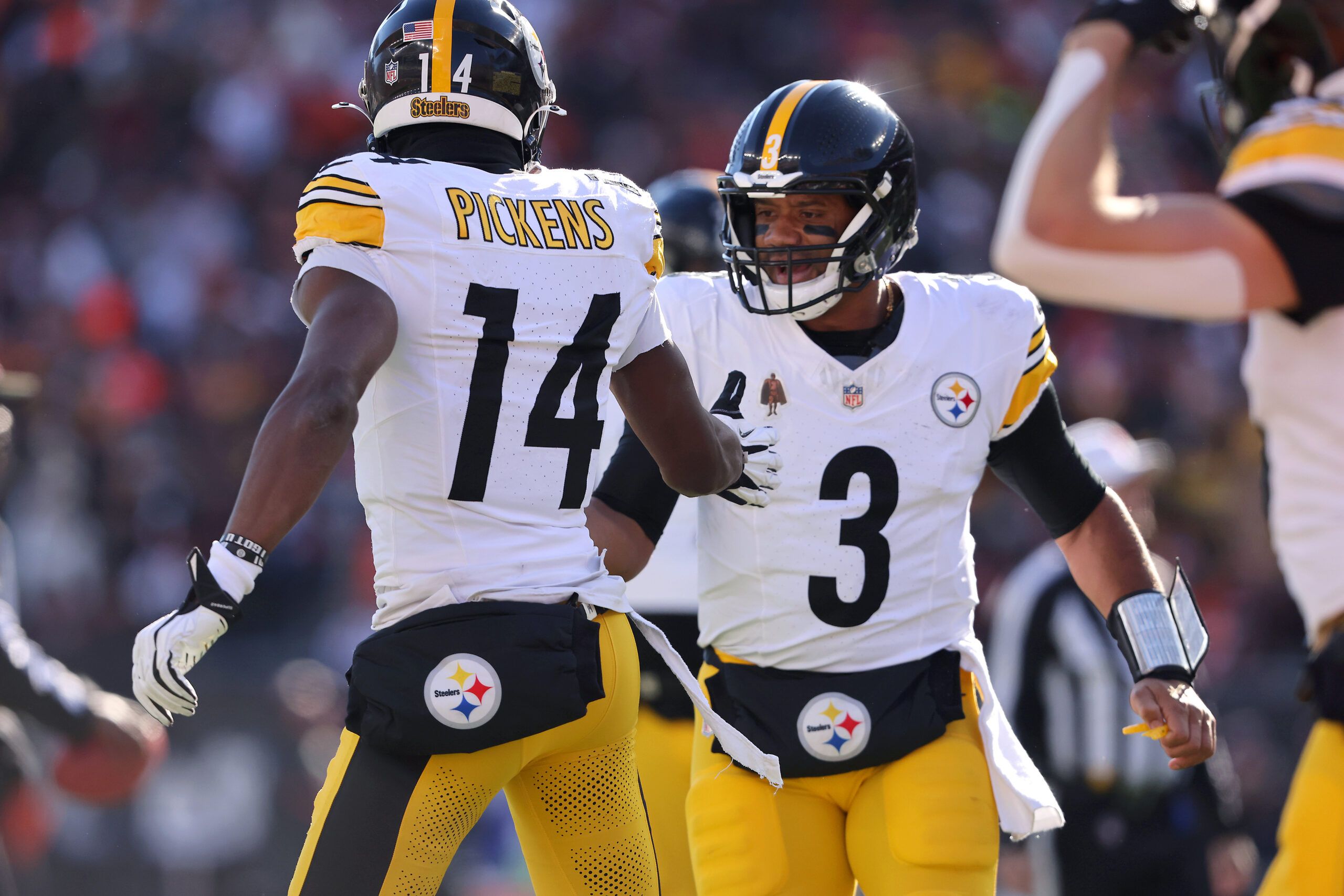 Dec 1, 2024; Cincinnati, Ohio, USA; Pittsburgh Steelers wide receiver George Pickens (14) celebrates his touchdown catch with quarterback Russell Wilson (3) during the first quarter against the Cincinnati Bengals at Paycor Stadium. Mandatory Credit: Joseph Maiorana-Imagn Images