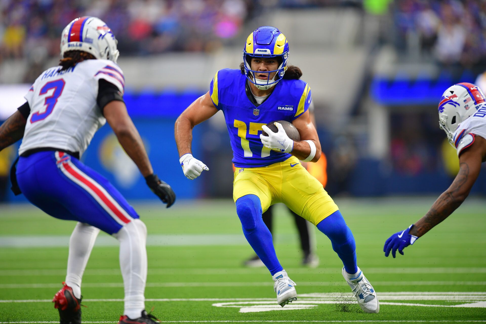 Los Angeles Rams wide receiver Puka Nacua (17) runs the ball against Buffalo Bills safety Damar Hamlin (3) during the first half at SoFi Stadium.