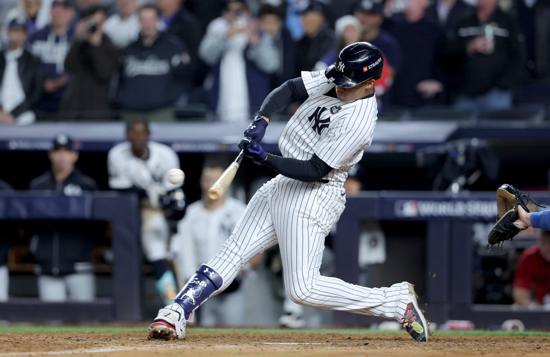 New York Yankees outfielder Juan Soto (22) doubles during the eighth inning against the Los Angeles Dodgers in game four of the 2024 MLB World Series at Yankee Stadium.