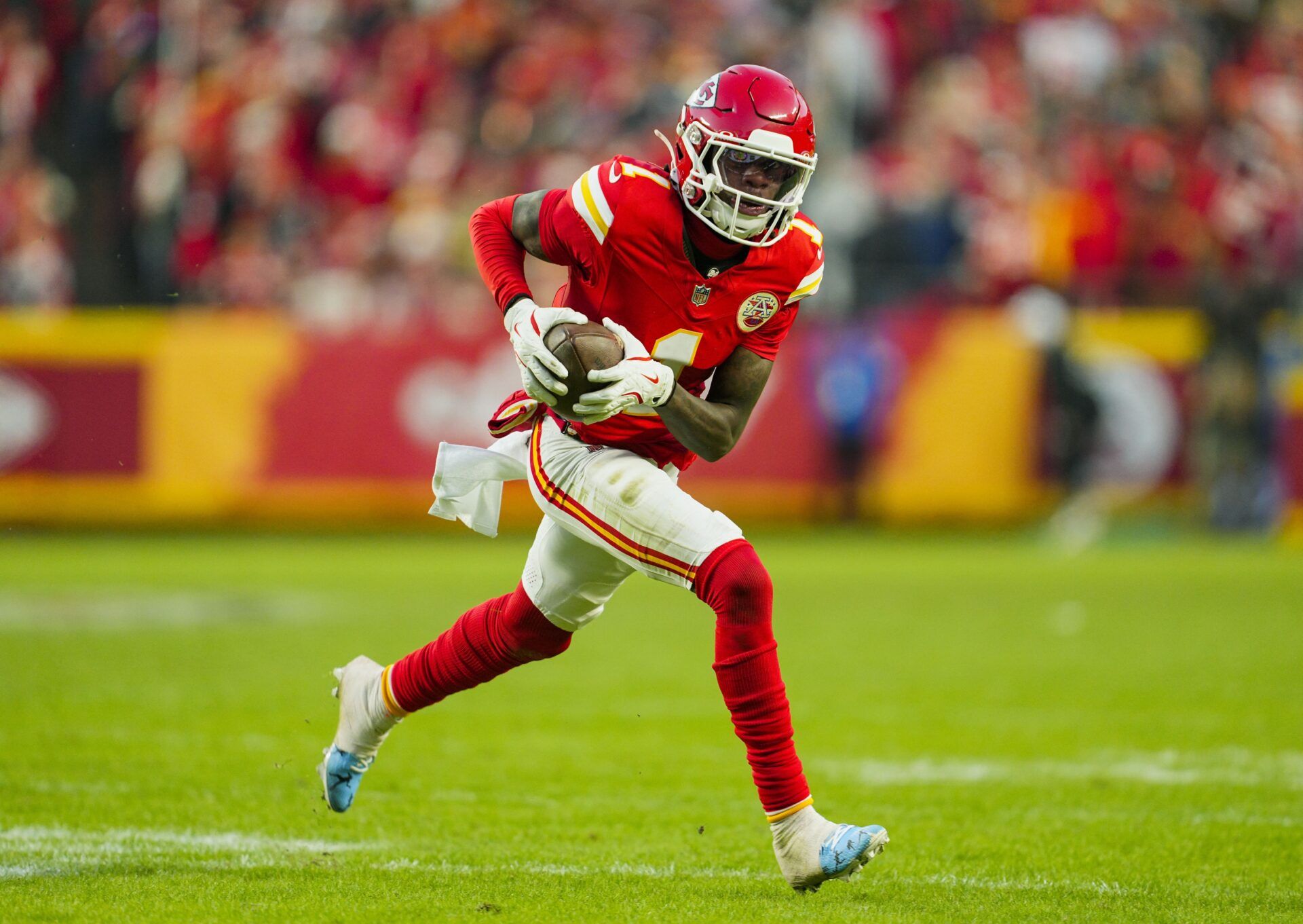 Kansas City Chiefs wide receiver Xavier Worthy (1) runs with the ball during the second half against the Las Vegas Raiders at GEHA Field at Arrowhead Stadium.