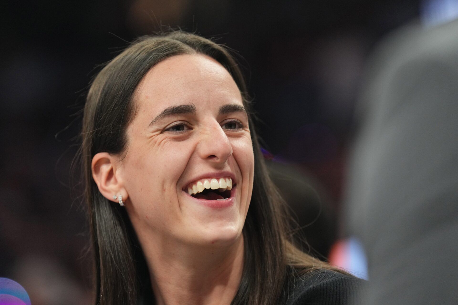 Indiana Fever player Caitlin Clark looks on during the second half of the game between the Phoenix Suns and the Golden State Warriors at Footprint Center.