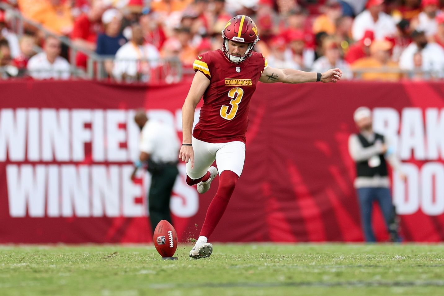 Washington Commanders place kicker Cade York (3) kicks off against the Tampa Bay Buccaneers in the third quarter at Raymond James Stadium.