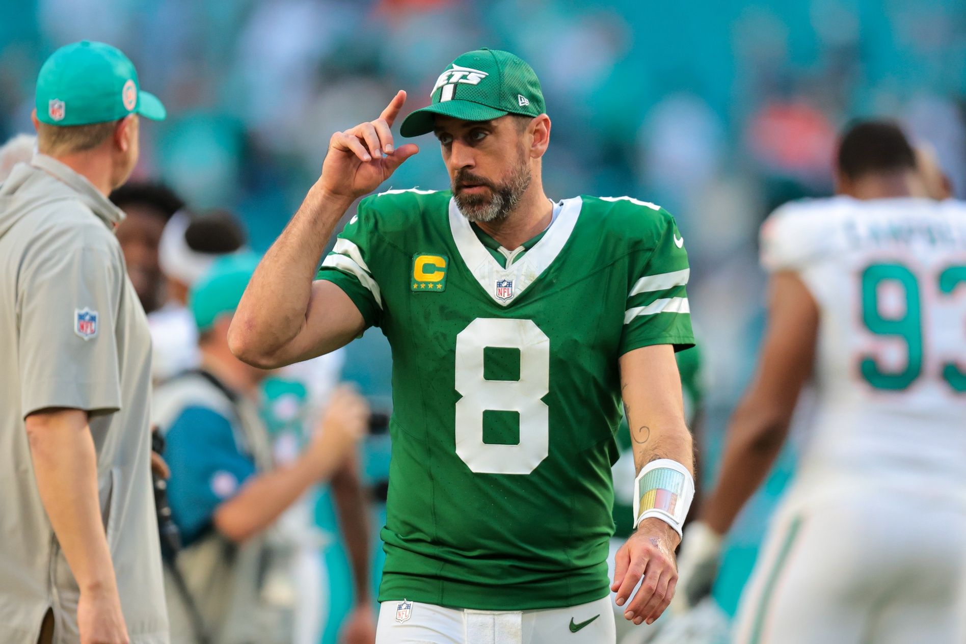 New York Jets quarterback Aaron Rodgers (8) reacts from the field after the game against the Miami Dolphins at Hard Rock Stadium.