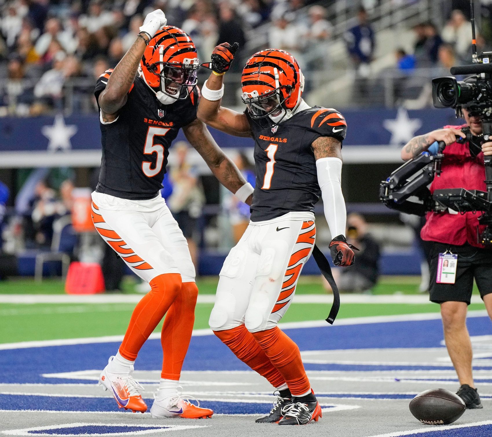 Cincinnati Bengals wide receiver Tee Higgins (5) and wide receiver Ja'Marr Chase (1) dance after Chase scored a touchdown in the 4th quarter to beat the Dallas Cowboys in Monday Night Football at AT&T Stadium in Arlington, Texas on Monday, December 9, 2024.