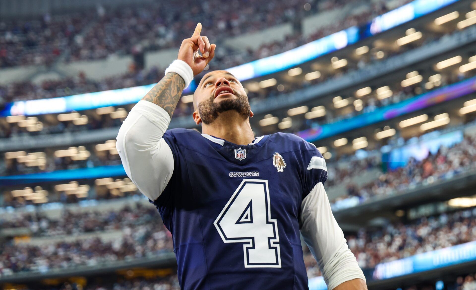 Dallas Cowboys quarterback Dak Prescott (4) prays before the game against the Detroit Lions at AT&T Stadium.