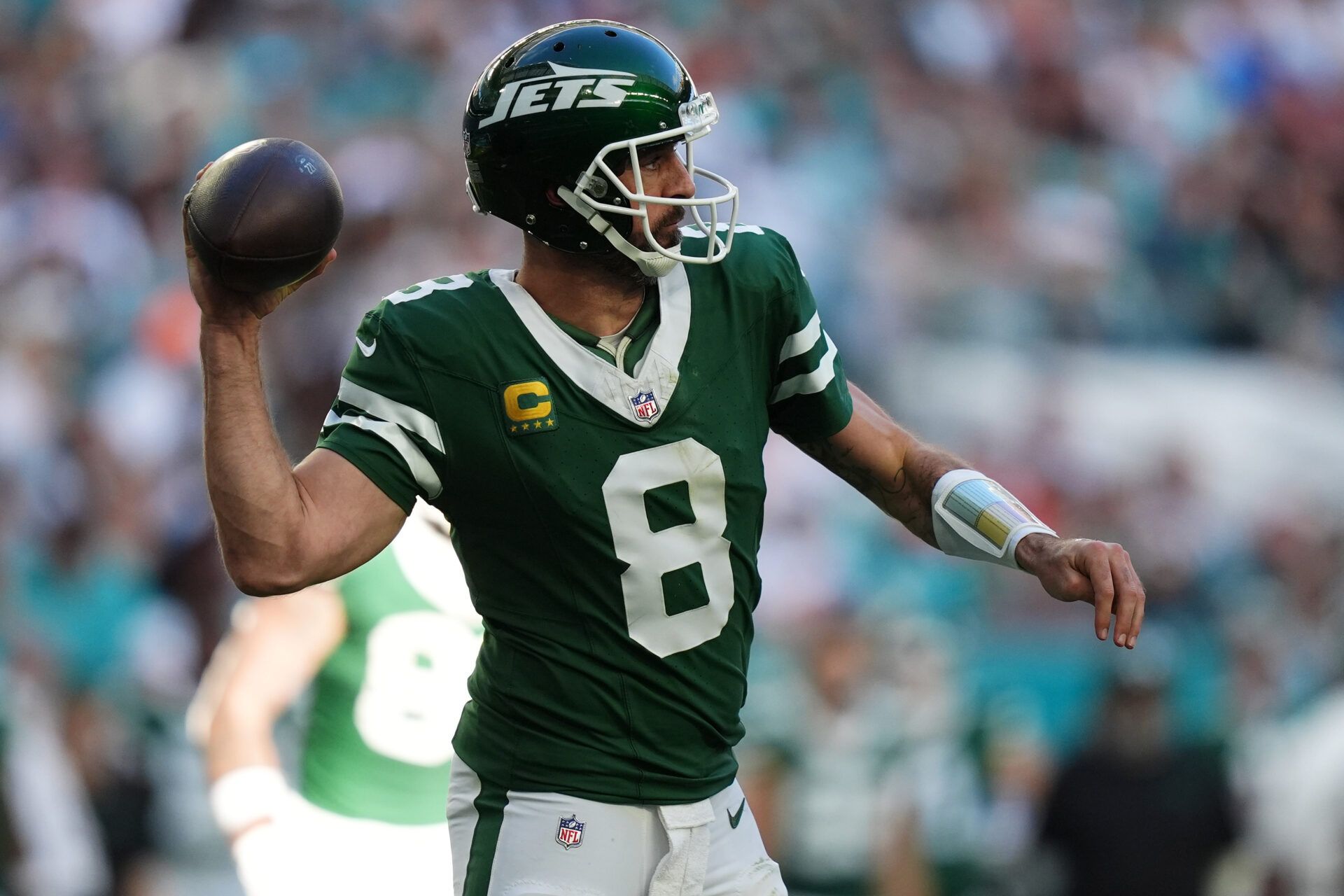 Dec 8, 2024; Miami Gardens, Florida, USA; New York Jets quarterback Aaron Rodgers (8) attempts a pass against the Miami Dolphins during the second half at Hard Rock Stadium. Mandatory Credit: Jasen Vinlove-Imagn Images