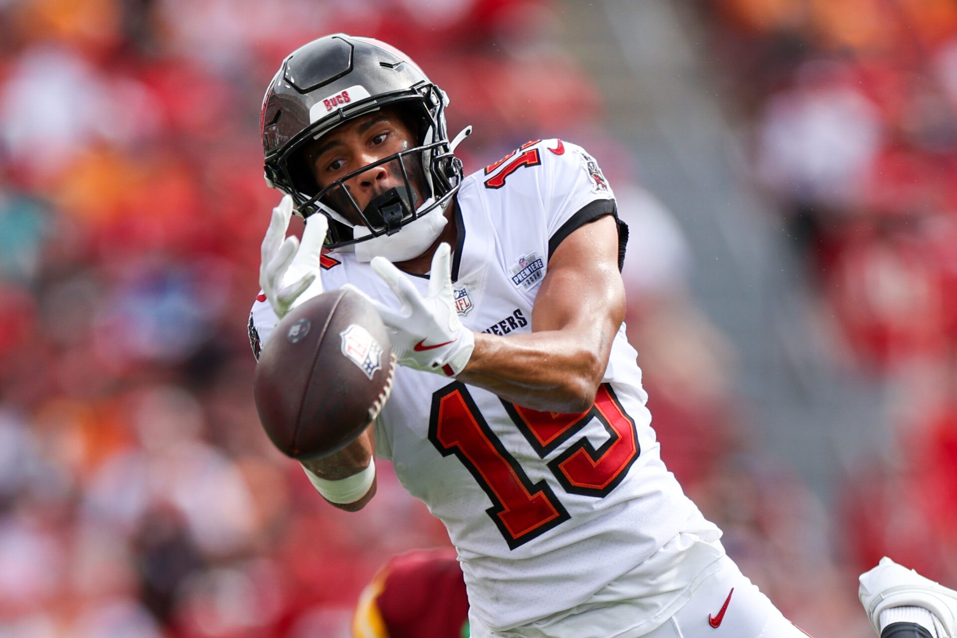 Sep 8, 2024; Tampa, Florida, USA; Tampa Bay Buccaneers wide receiver Jalen McMillan (15) reaches for a pass against the Washington Commanders in the first quarter at Raymond James Stadium. Mandatory Credit: Nathan Ray Seebeck-Imagn Images