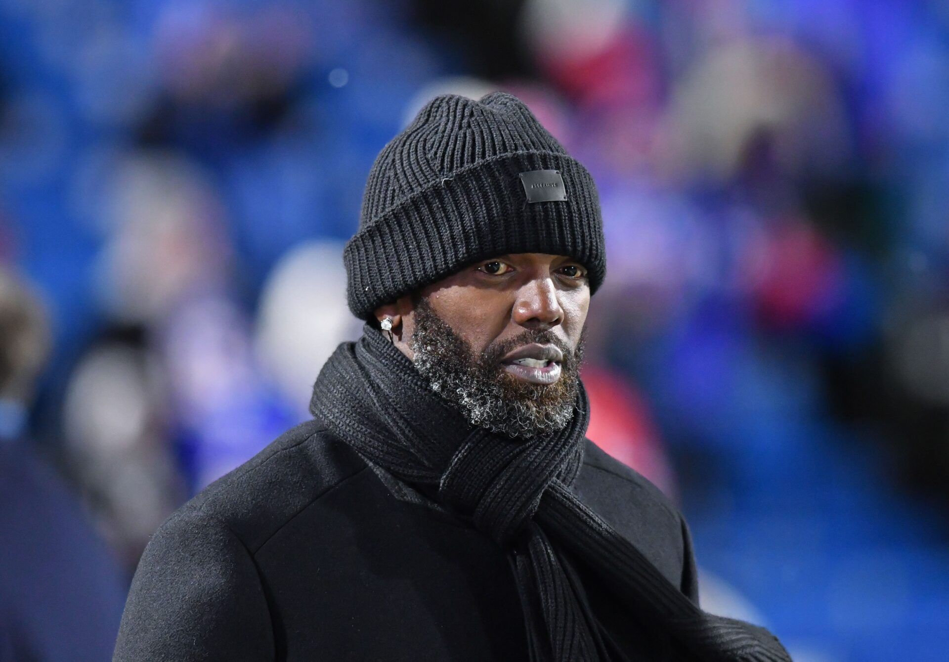 ESPN commentator and NFL Hall of Fame member Randy Moss on the sidelines before a game between the Buffalo Bills and New England Patriots at Highmark Stadium.