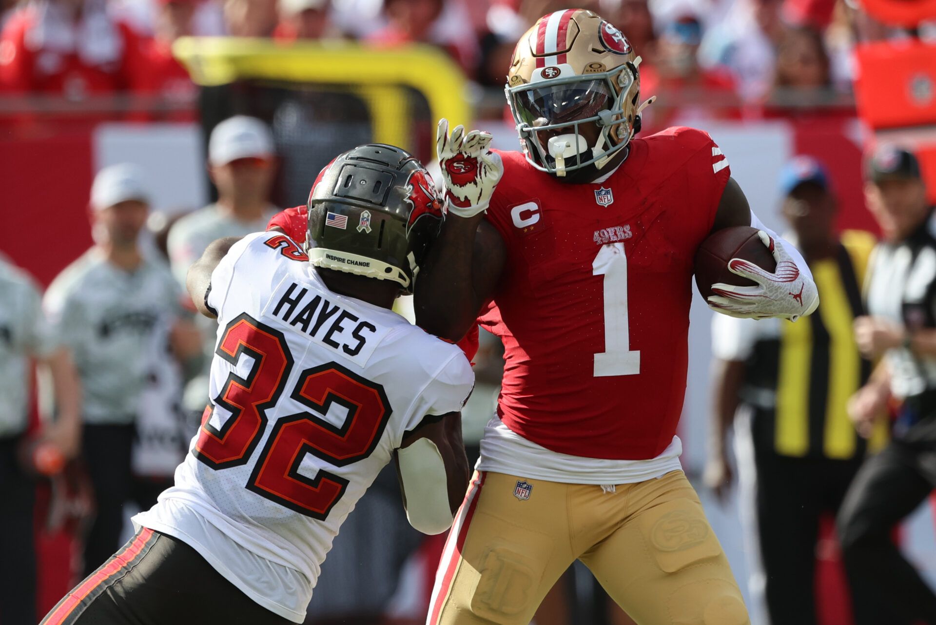 Nov 10, 2024; Tampa, Florida, USA; San Francisco 49ers wide receiver Deebo Samuel Sr. (1) stiff arms Tampa Bay Buccaneers safety Josh Hayes (32) during the second half at Raymond James Stadium. Mandatory Credit: Kim Klement Neitzel-Imagn Images