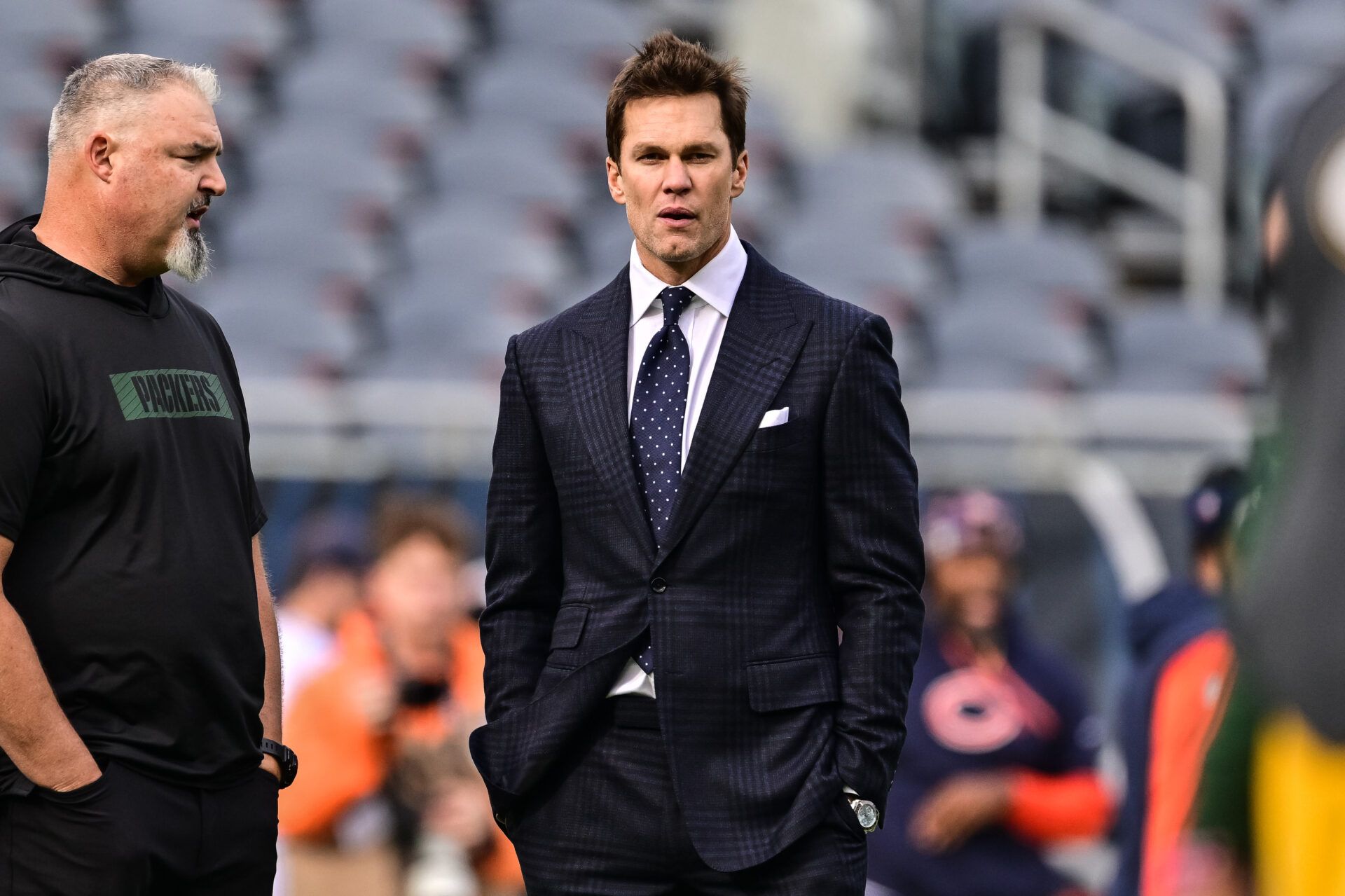 Nov 17, 2024; Chicago, Illinois, USA; Former quarterback and current NFL announcer Tom Brady looks on before the game between the Chicago Bears and Green Bay Packers at Soldier Field. Mandatory Credit: Daniel Bartel-Imagn Images