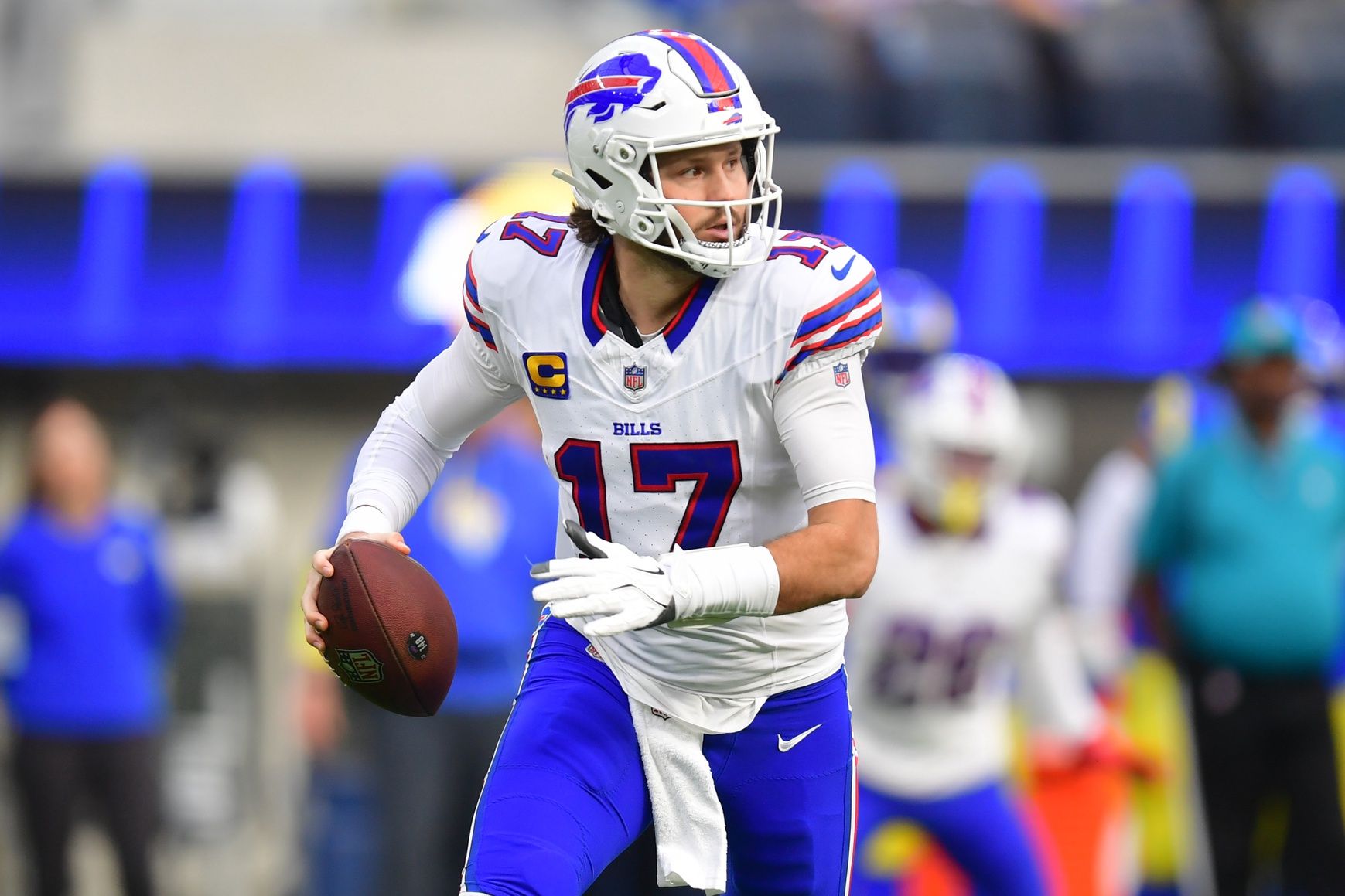 Buffalo Bills quarterback Josh Allen (17) runs the ball against the against the Los Angeles Rams during the first half at SoFi Stadium.