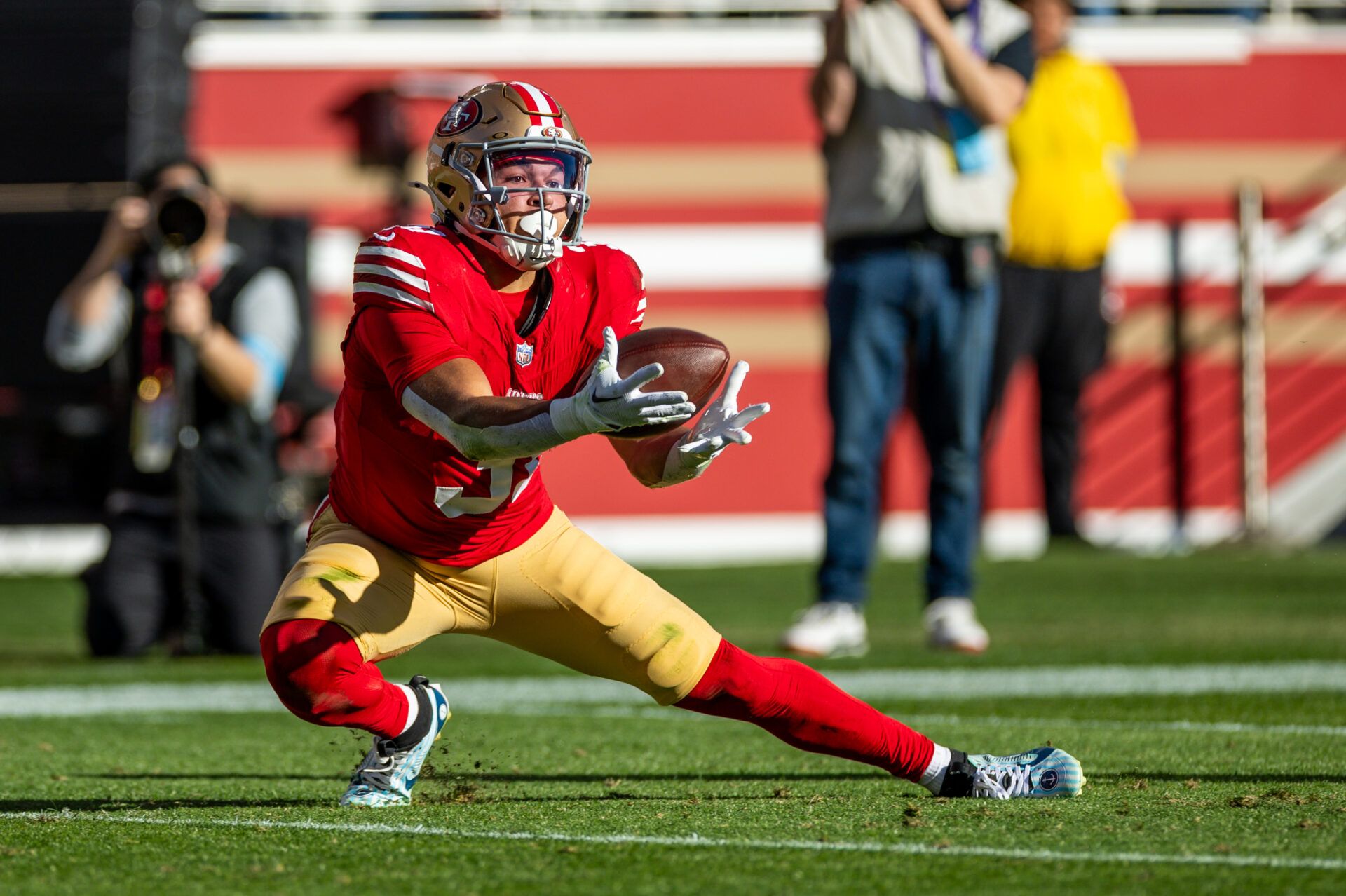 Dec 8, 2024; Santa Clara, California, USA; San Francisco 49ers running back Isaac Guerendo (31) catches a long pass during the first quarter against the Chicago Bears at Levi's Stadium. Mandatory Credit: Bob Kupbens-Imagn Images