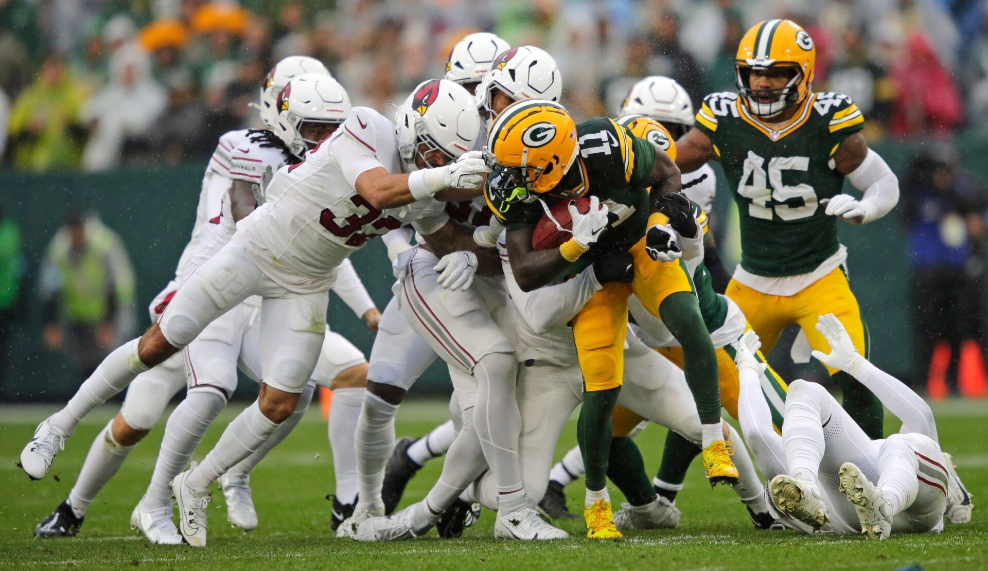 Arizona Cardinals safety Joey Blount (32) commits a facemask penalty against Green Bay Packers wide receiver Jayden Reed (11) during their football game Sunday, October 13, 2024, at Lambeau Field in Green Bay, Wisconsin.